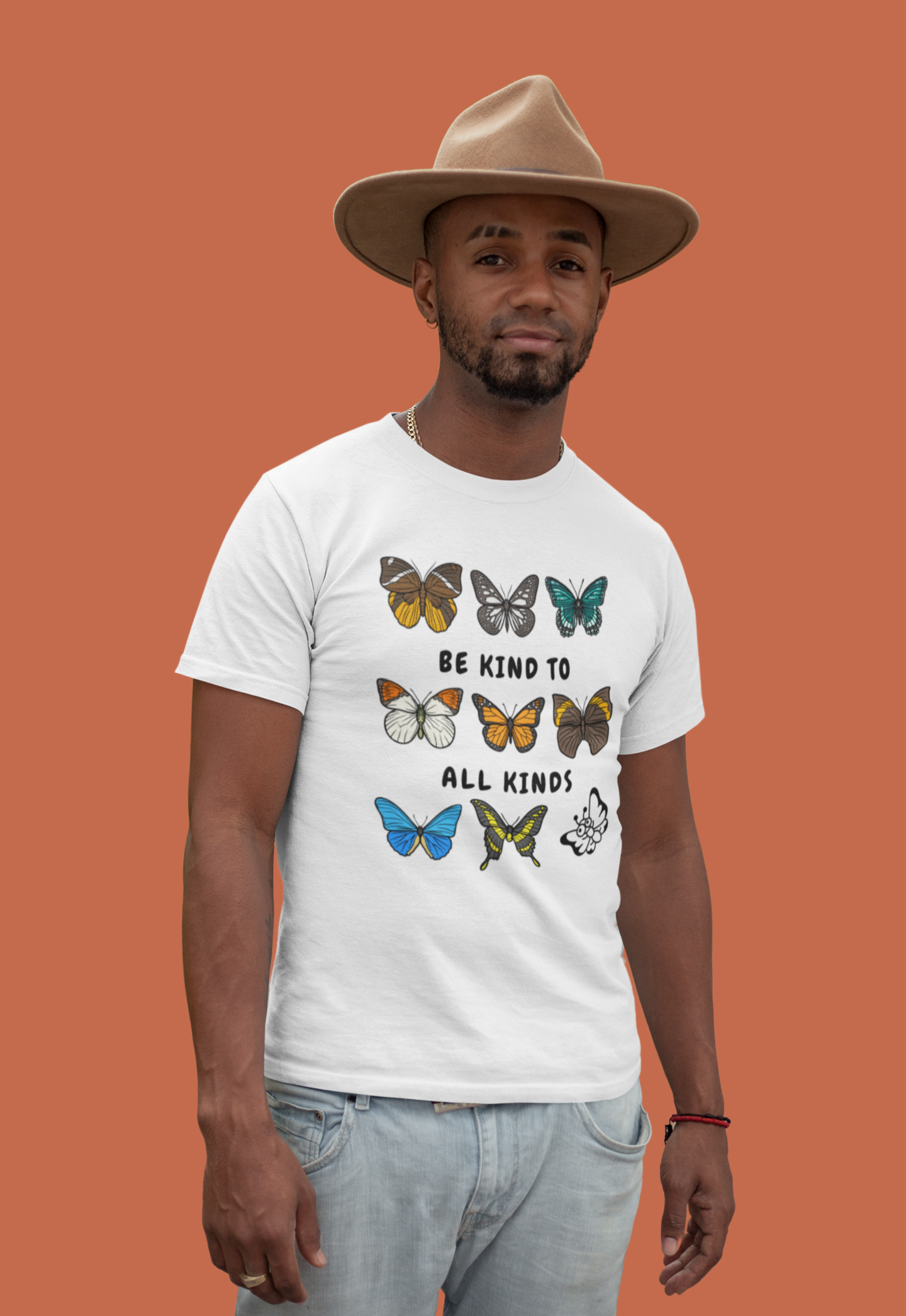 white butterflies and moths kindness shirt worn by model wearing a felt hat