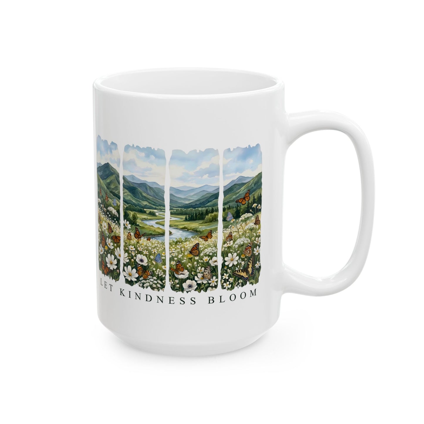 Angled view of a white Let Kindness Bloom ceramic 15oz mug with floral meadow, butterflies, and scenic landscape design on a white background.