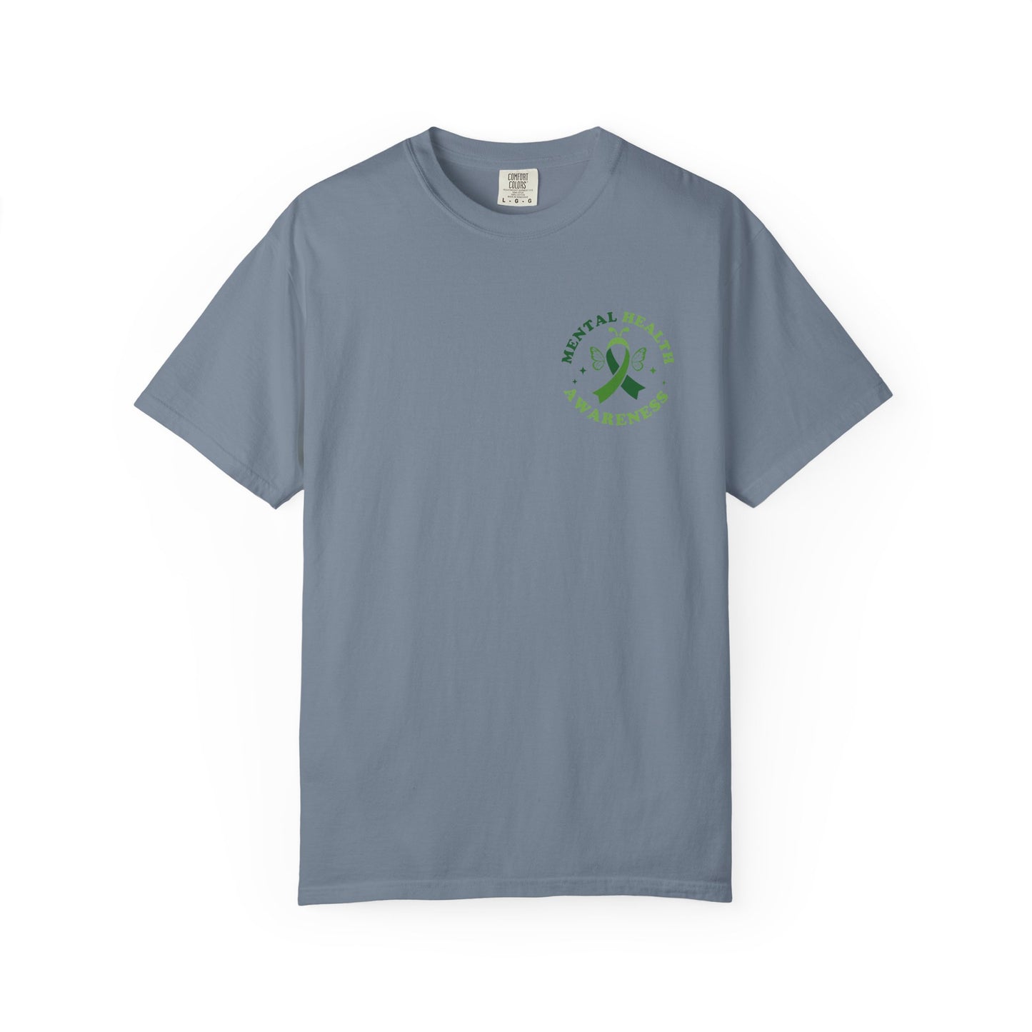 Blue garment-dyed mental health awareness t-shirt with a small green ribbon and butterfly chest graphic reading “Mental Health Awareness.”