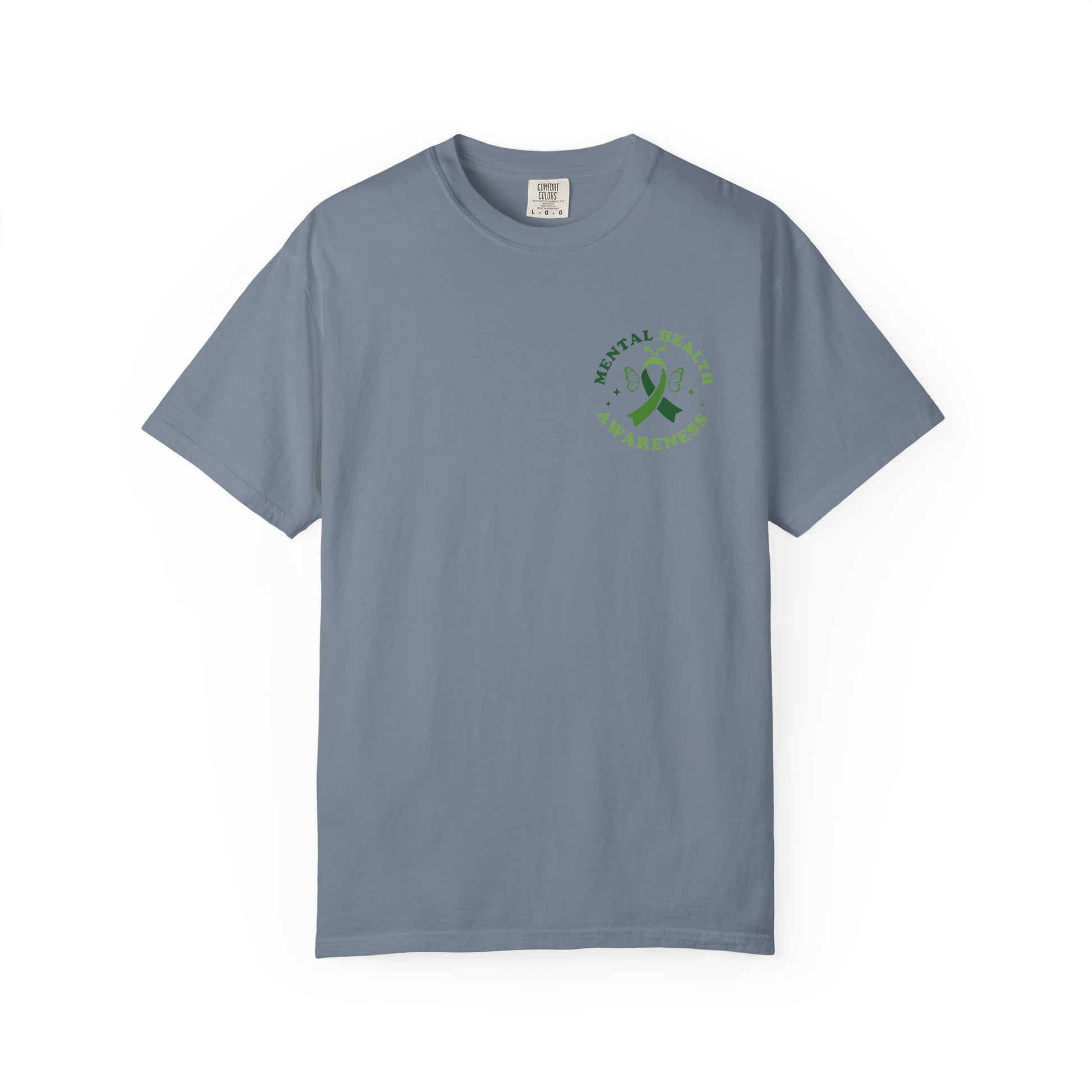 Blue garment-dyed mental health awareness t-shirt with a small green ribbon and butterfly chest graphic reading “Mental Health Awareness.”