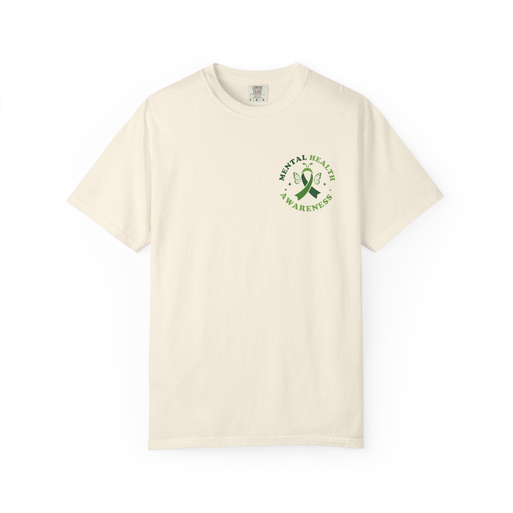 Cream garment-dyed mental health awareness t-shirt with a small green ribbon and butterfly chest graphic reading “Mental Health Awareness.”