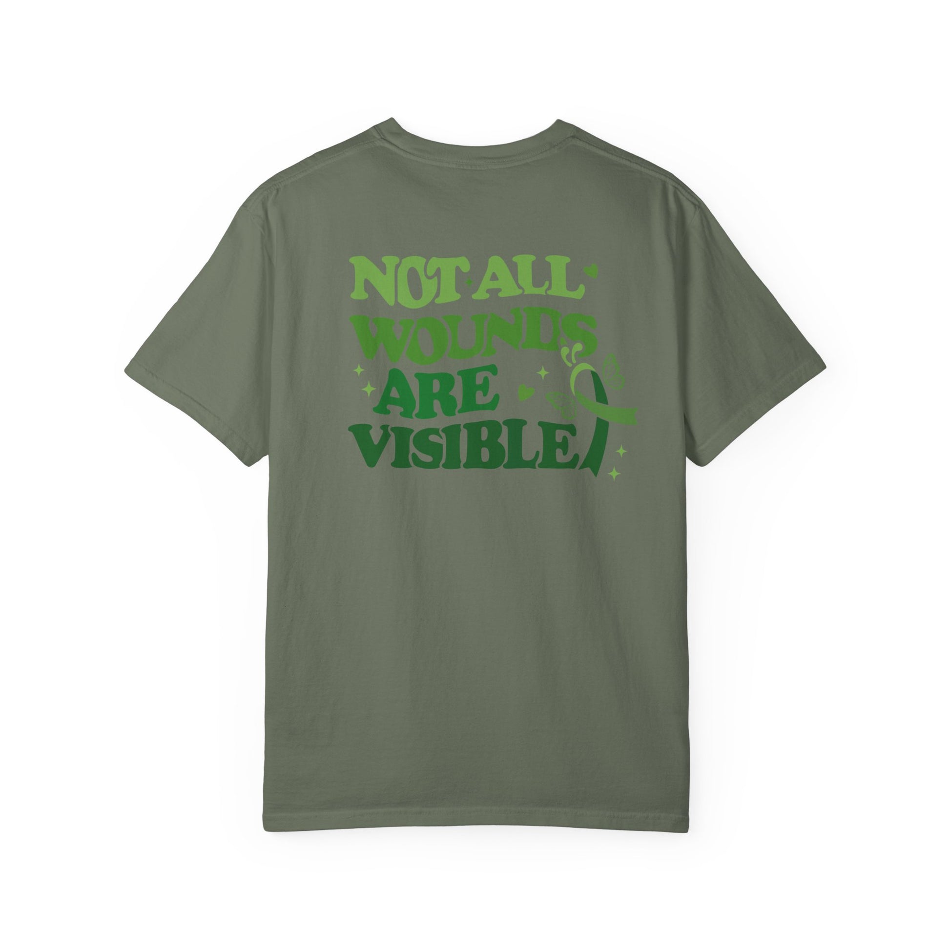 Back view of a green mental health awareness t-shirt featuring large green text reading “Not All Wounds Are Visible” with butterfly and green ribbon artwork.