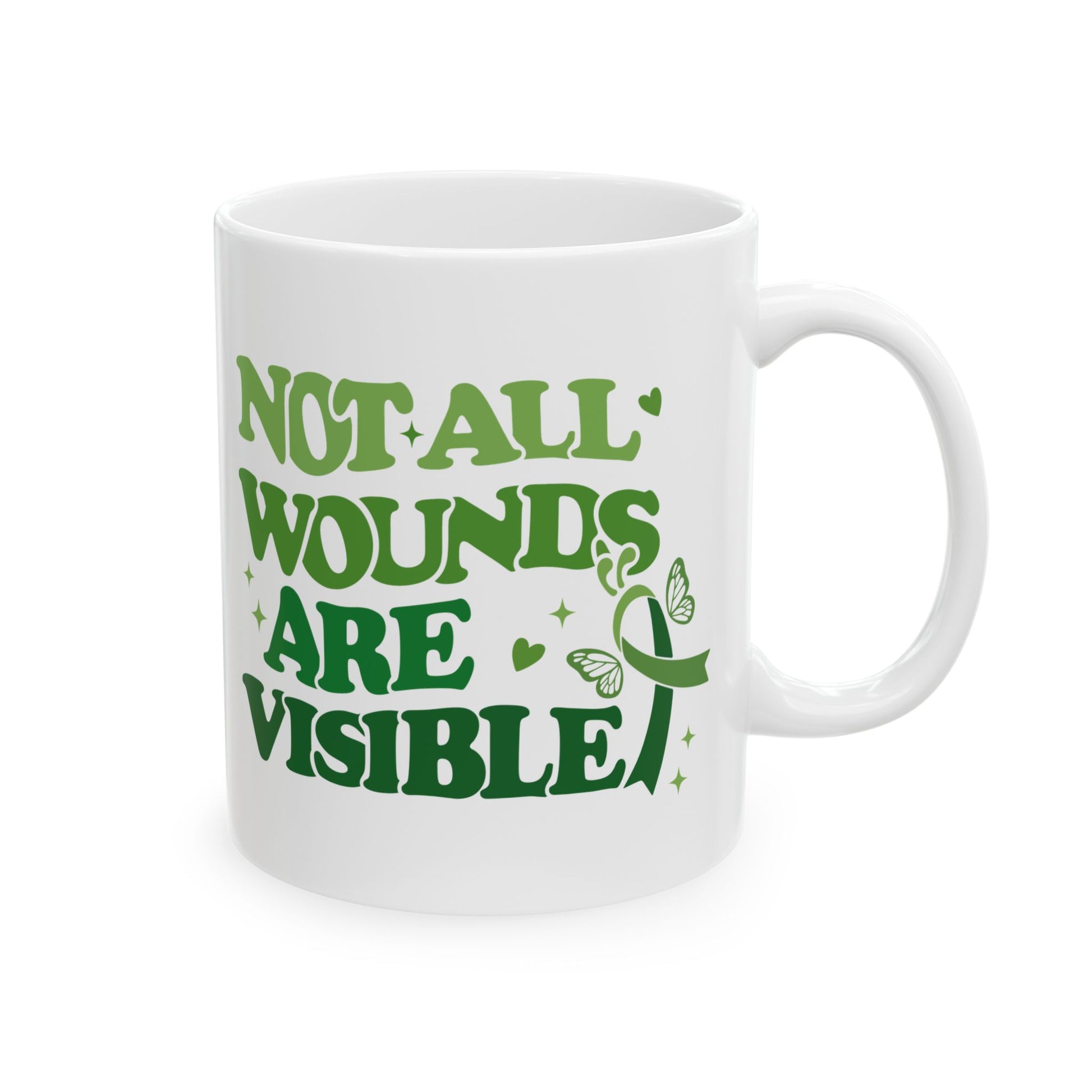 White glossy ceramic mental health awareness mug with green “Not All Wounds Are Visible” butterfly and green ribbon design, shown from the front.