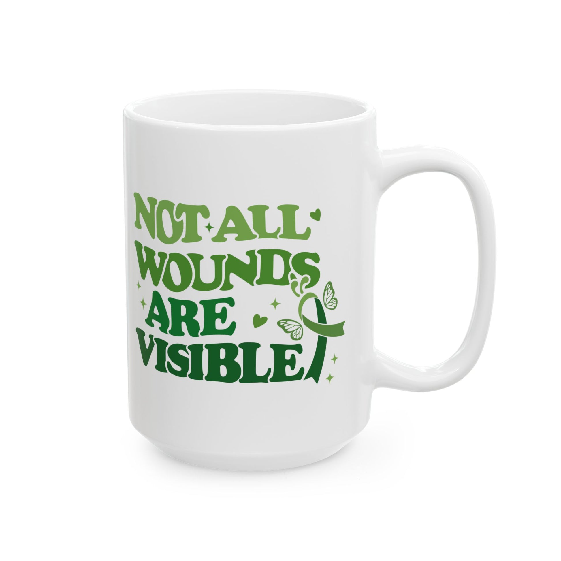 Large white glossy ceramic mental health awareness mug with green “Not All Wounds Are Visible” butterfly and ribbon graphic, shown with handle on the right.