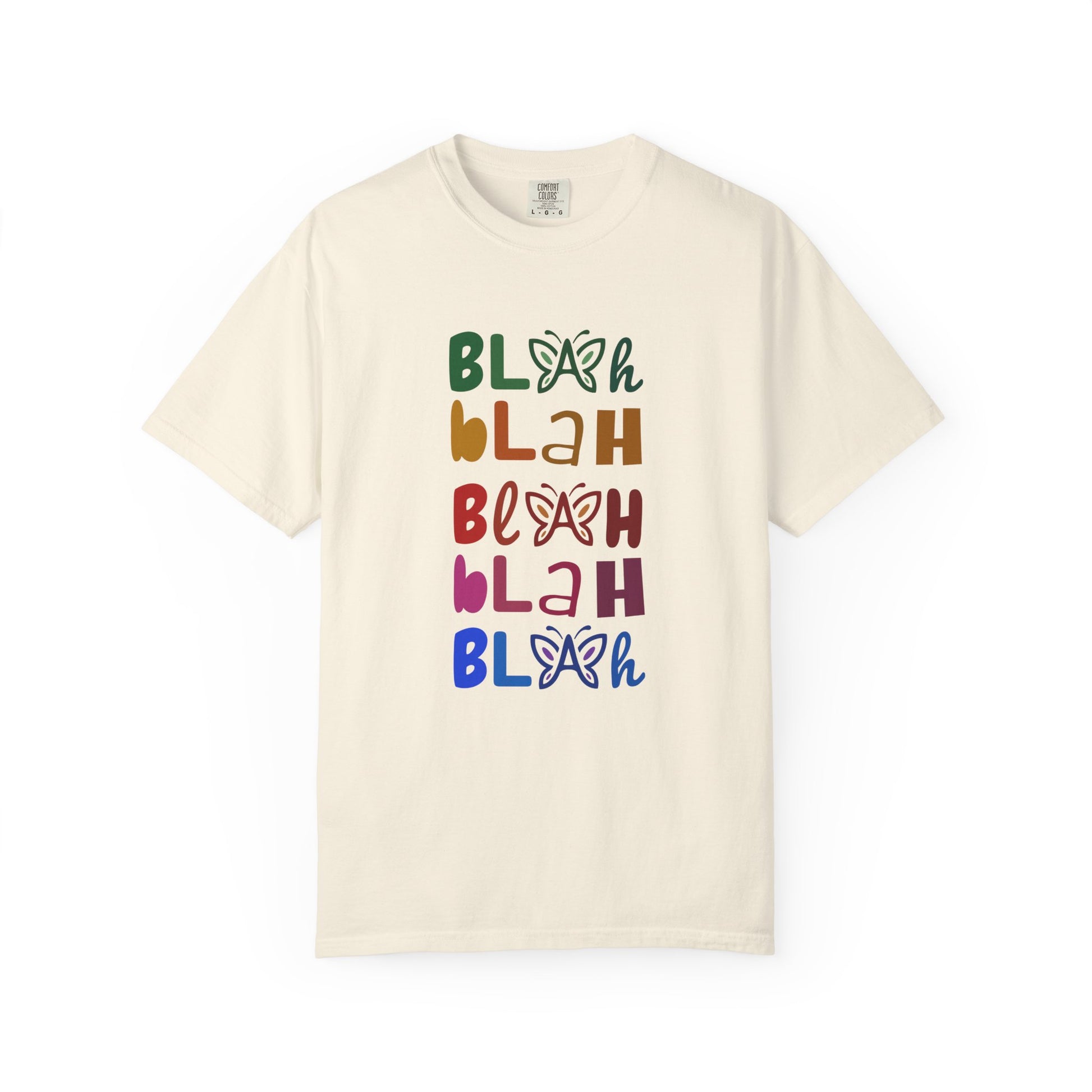 Cream t-shirt with colorful 'Blah Blah Blah' text and butterfly graphics on a white background