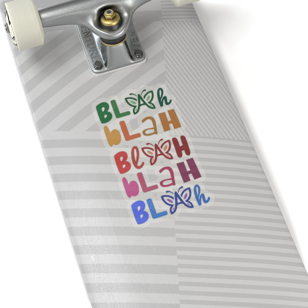 Skateboard with colorful 'Blah Blah Blah' vinyl sticker on a white background.