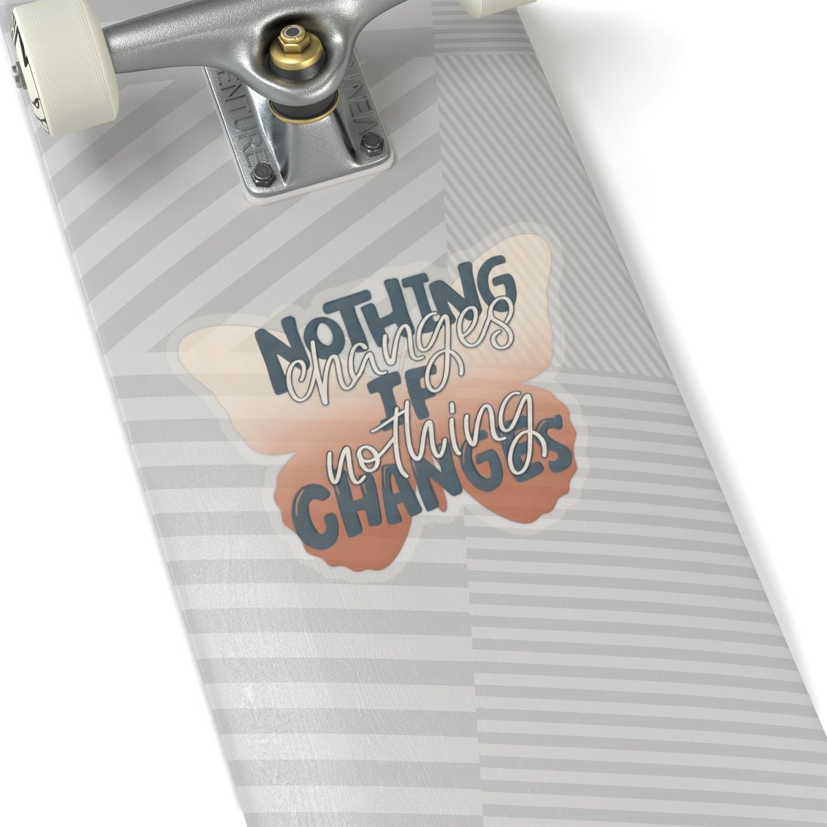 Skateboard with a butterfly motivational quote vinyl sticker on a white background