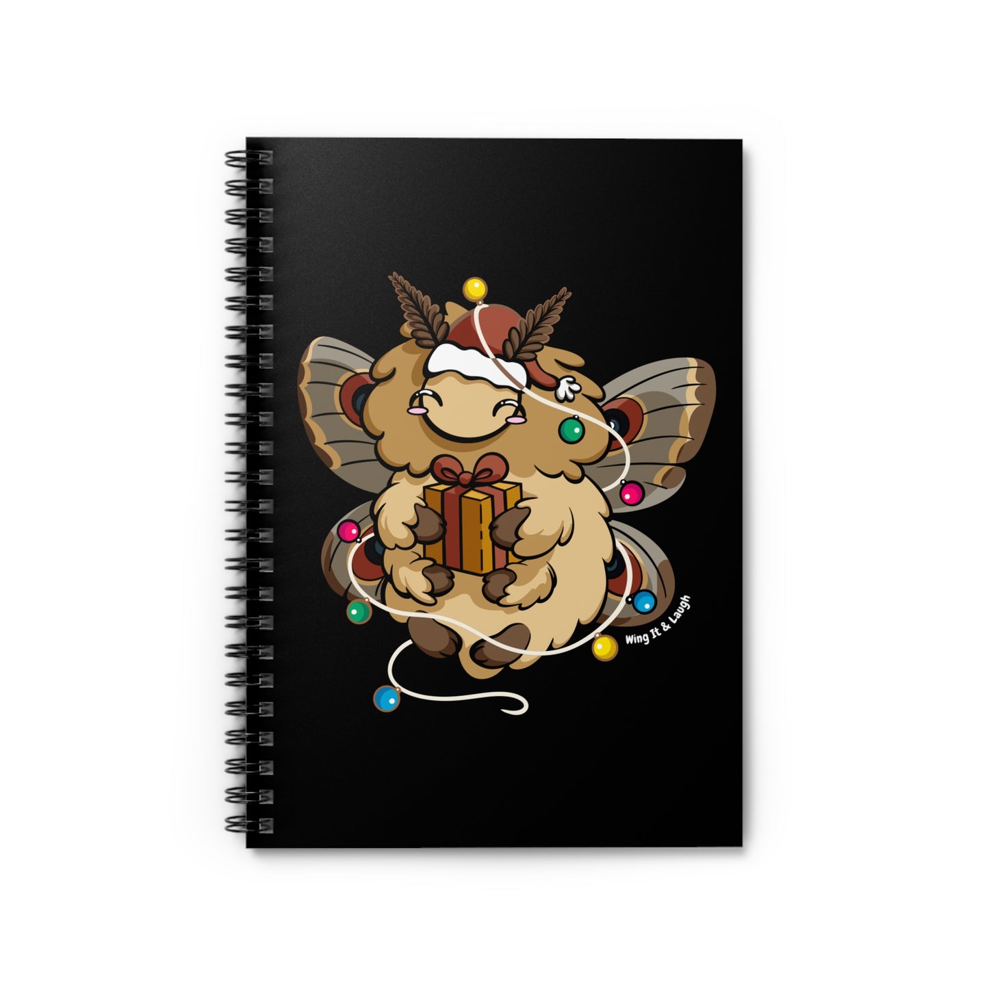 Black notebook with cute fluffy holiday moth holding a gift and surrounded by Christmas lights on a black background