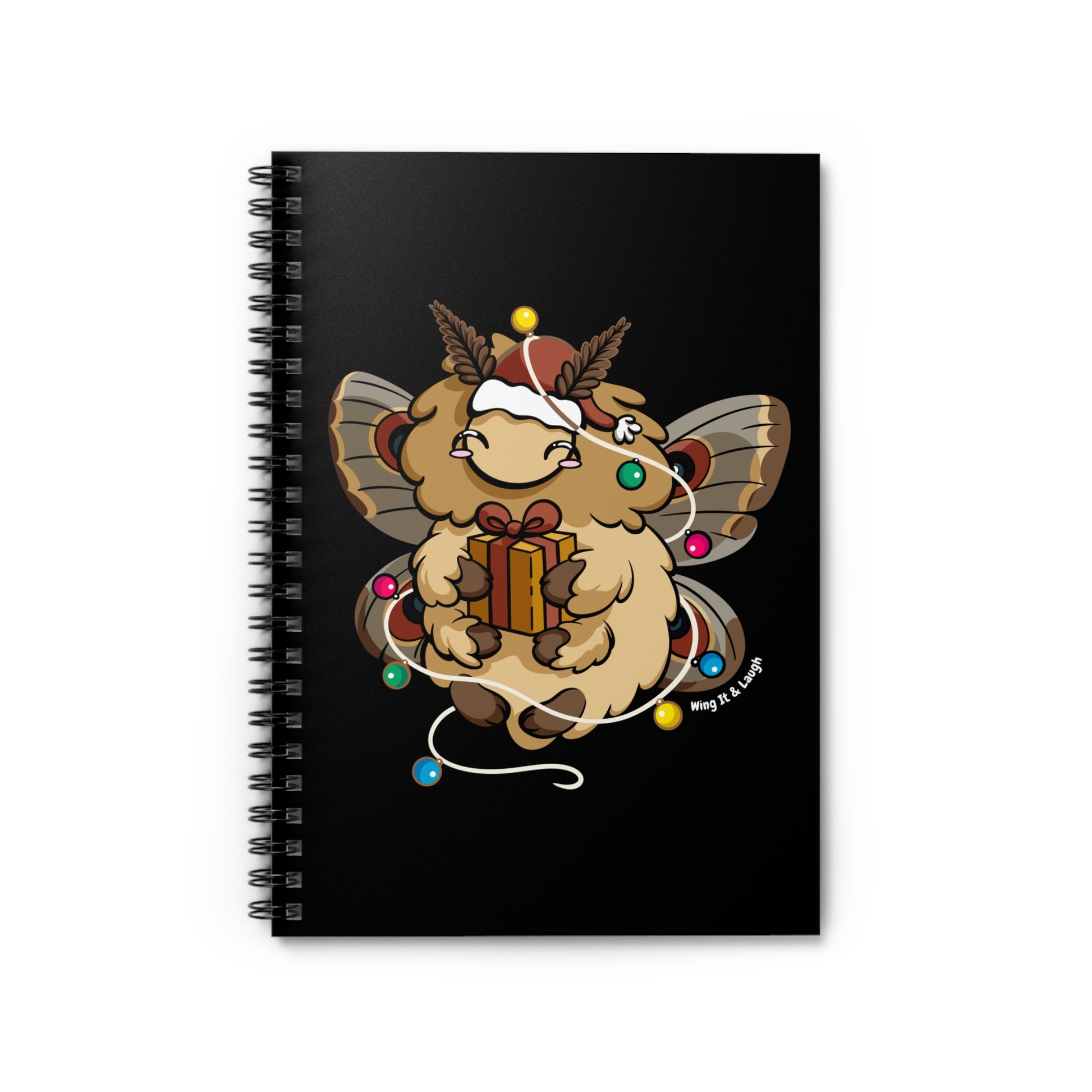 Black notebook with cute fluffy holiday moth holding a gift and surrounded by Christmas lights on a black background