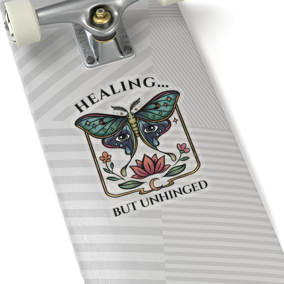 Skateboard deck with a colorful butterfly design and text on a white background