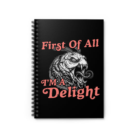 Black spiral notebook with the quote “First Of All I’m a Delight” and a detailed monster moth illustration in a retro sarcastic design.