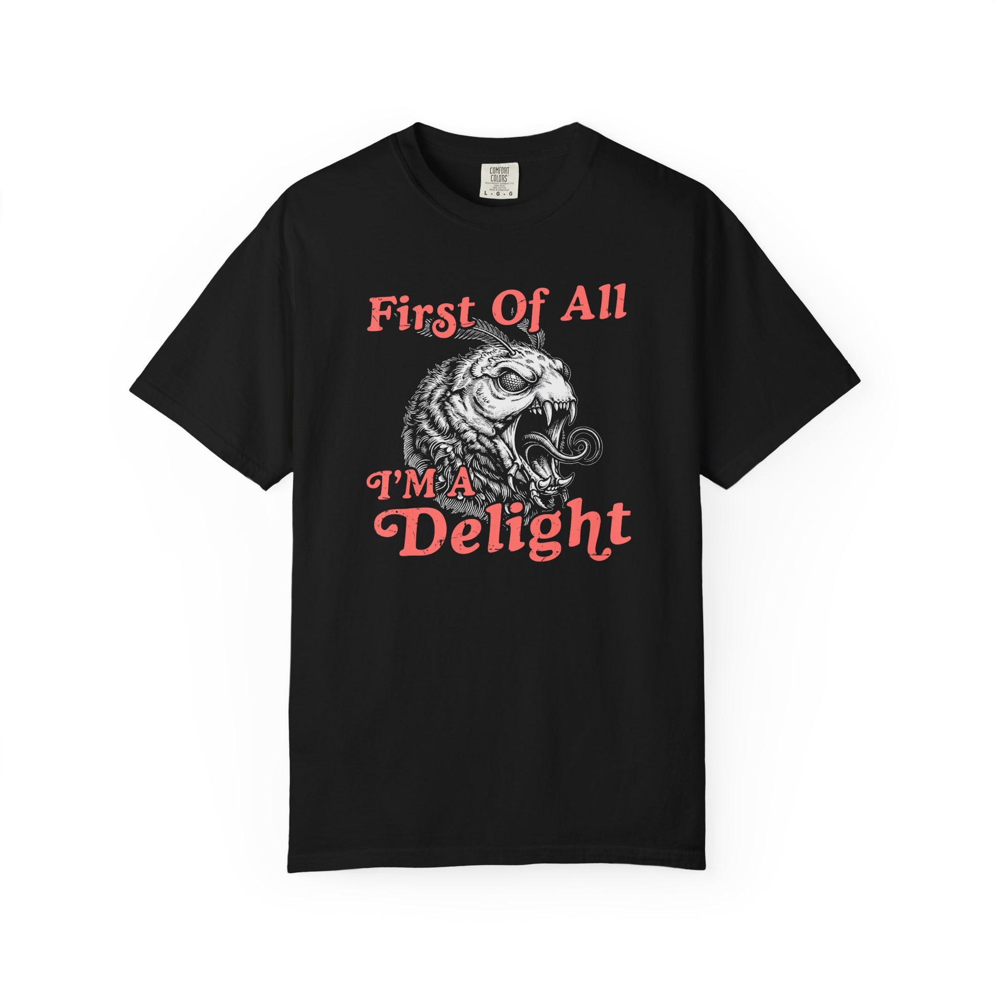 Black t-shirt with vintage coral text reading “First Of All I’m a Delight” and a detailed monster moth graphic in the center.