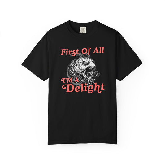 Black t-shirt with vintage coral text reading “First Of All I’m a Delight” and a detailed monster moth graphic in the center.