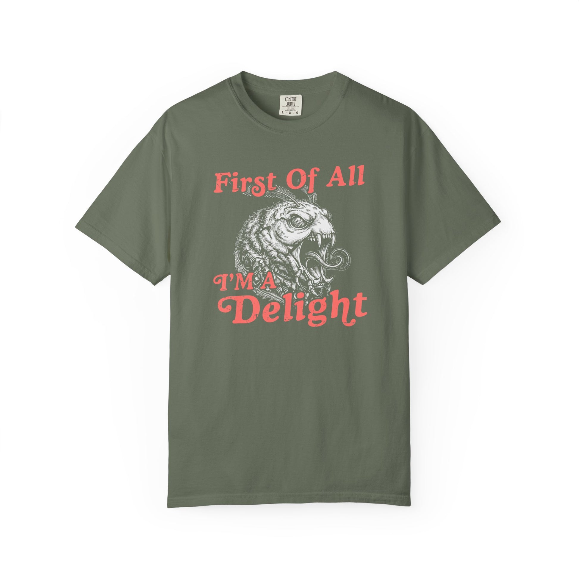 Green t-shirt displaying a funny sarcastic monster moth graphic with the phrase First Of All I’m a Delight.