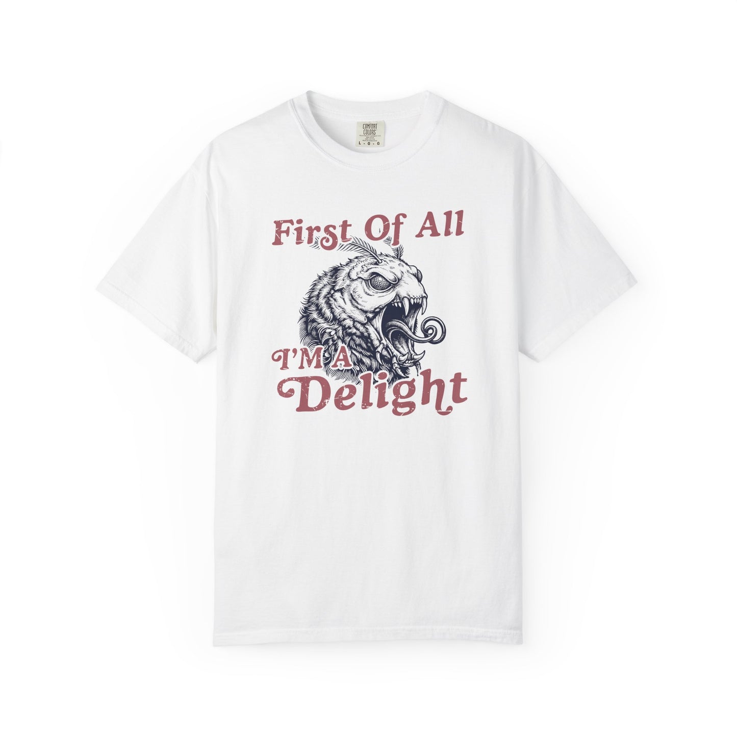 White t-shirt featuring the First Of All I’m a Delight slogan with a retro monster moth illustration on the front.