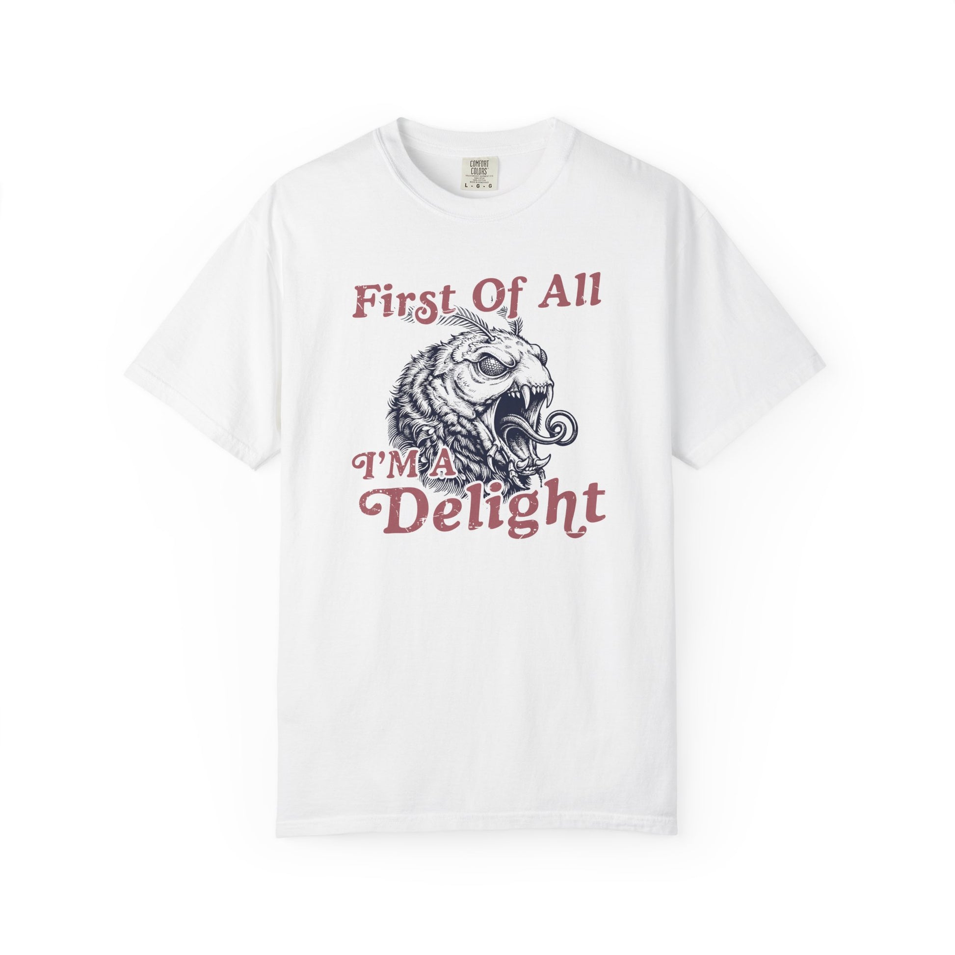 White t-shirt featuring the First Of All I’m a Delight slogan with a retro monster moth illustration on the front.