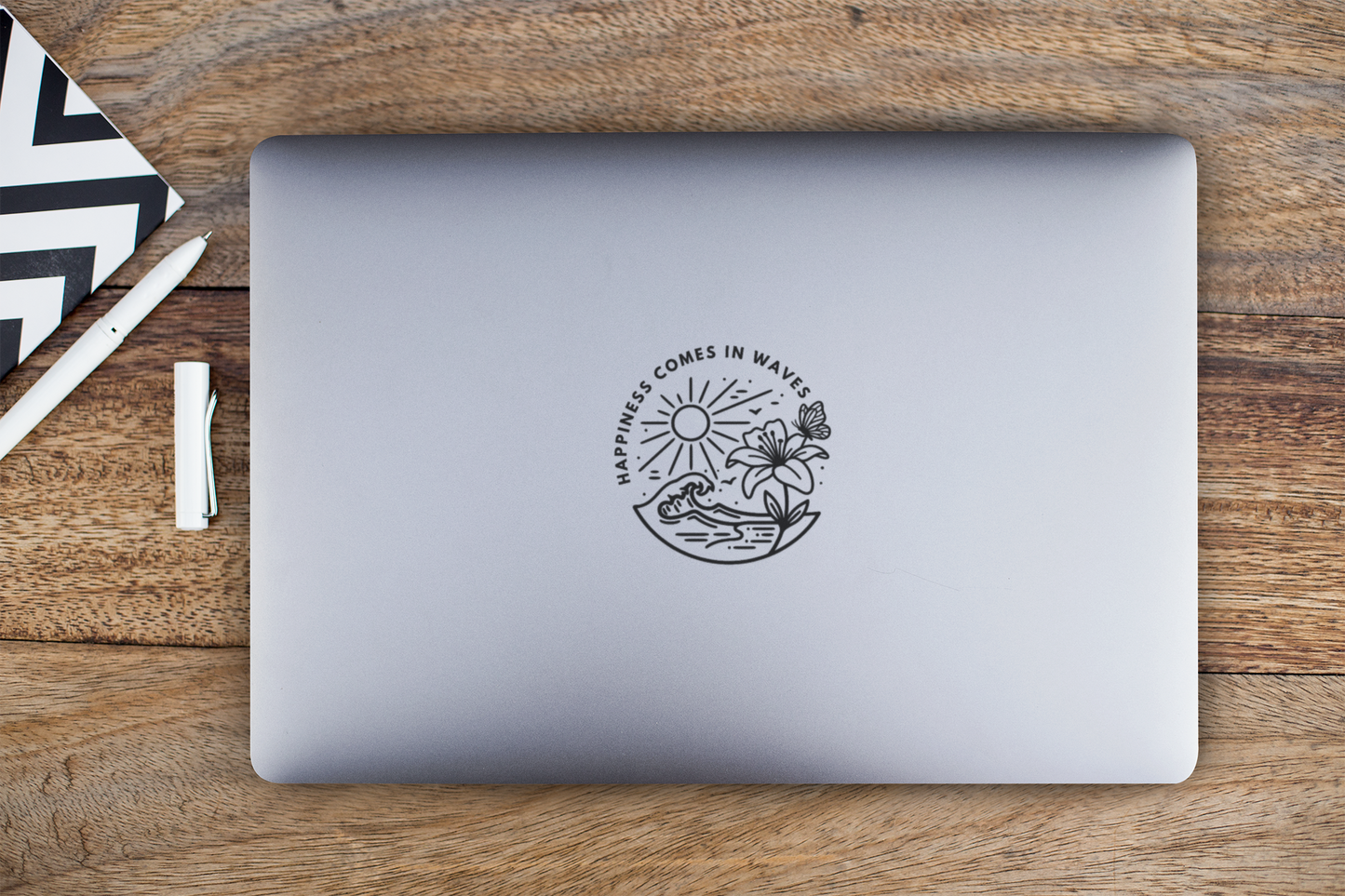 Small Happiness Comes in Waves beach butterfly sticker centered on laptop lid