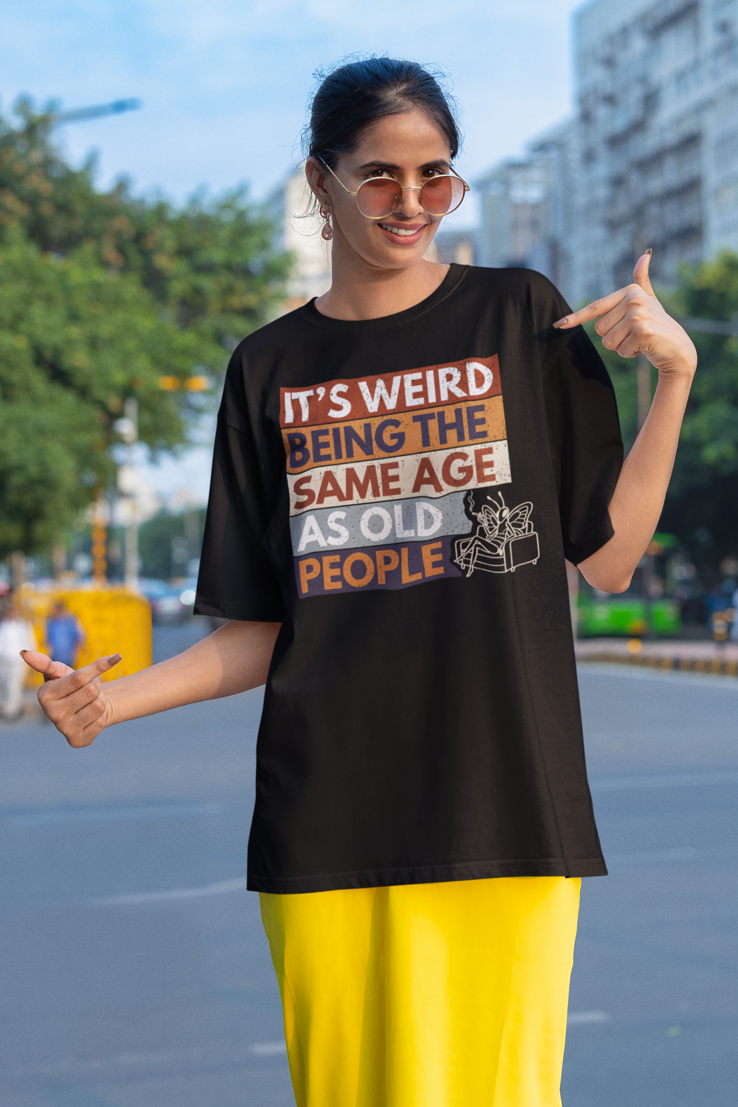 woman wearing funny aging humor butterfly t shirt sarcastic old people quote outfit on a city street