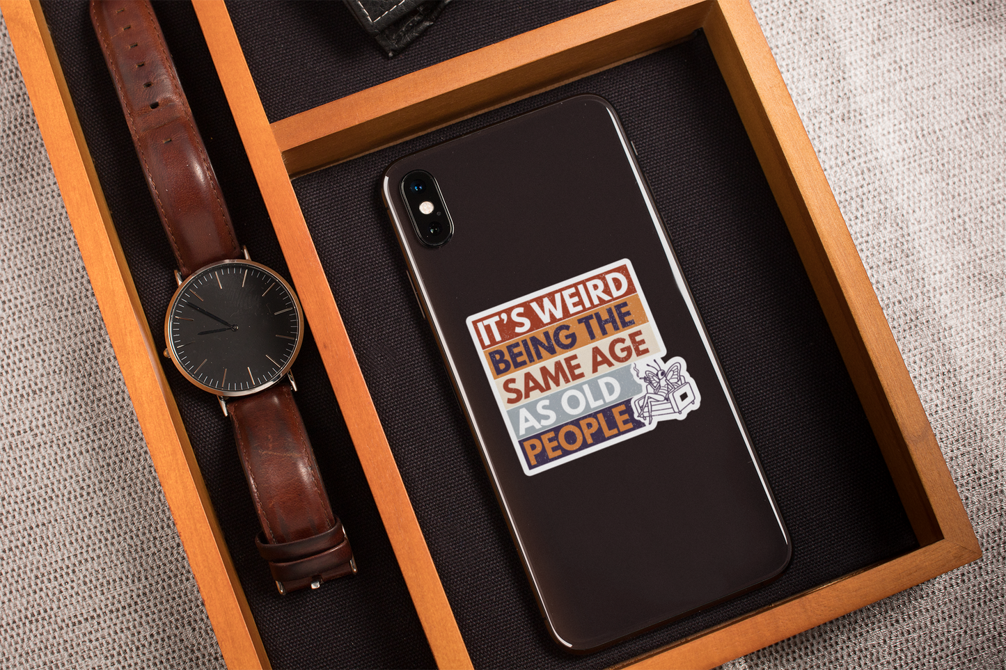 funny aging humor butterfly sticker on phone case sarcastic retro design on a wooden box with a watch
