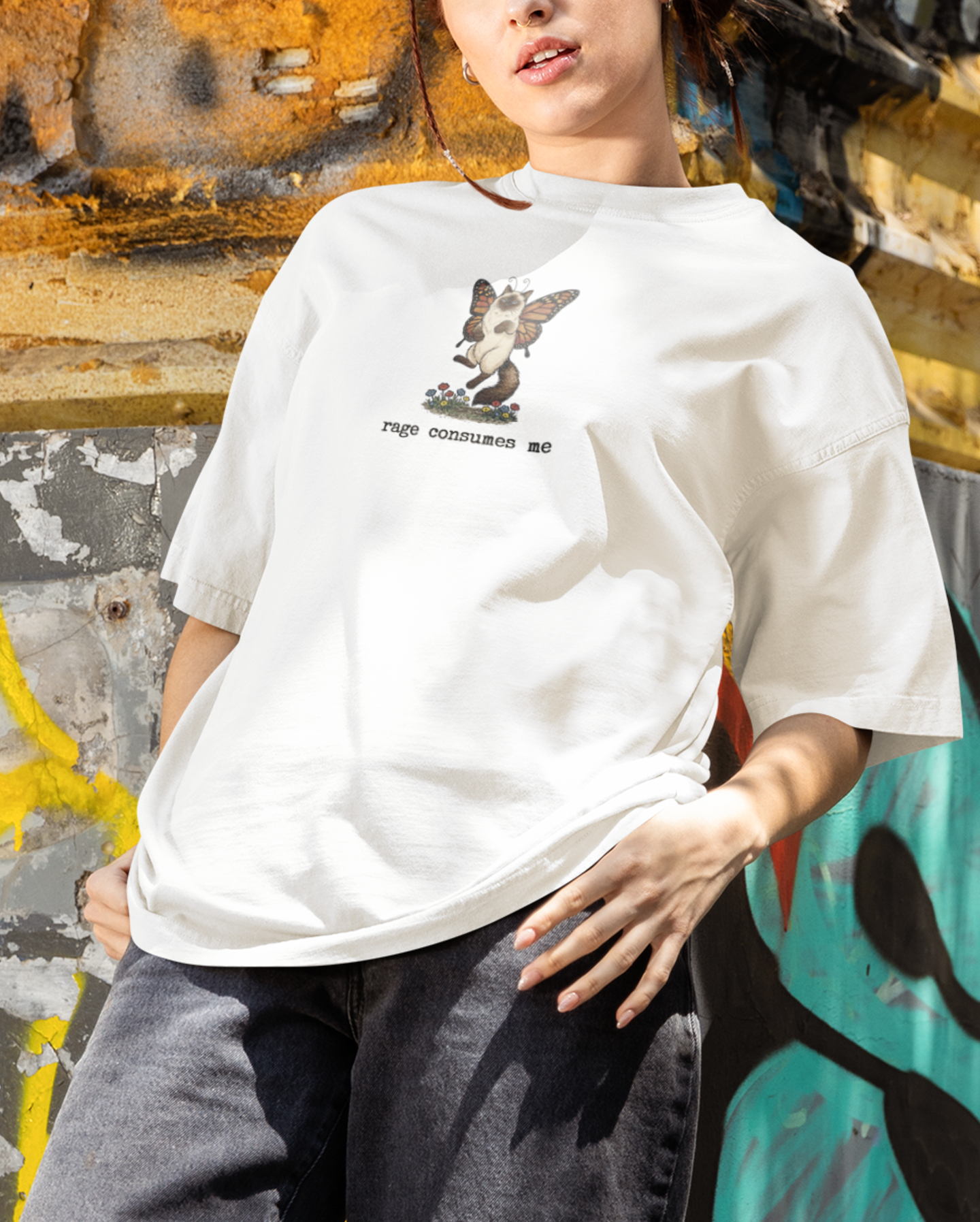 White sarcastic cat graphic tee worn by model with Rage Consumes Me design