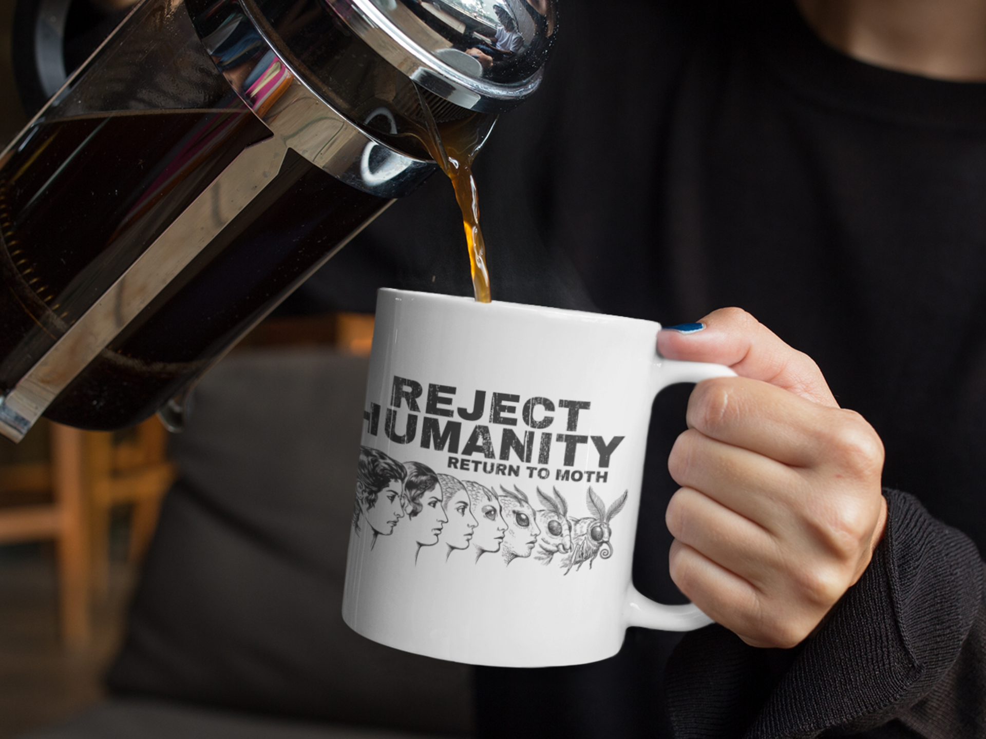 Person pouring coffee into funny moth meme mug with reject humanity return to moth design