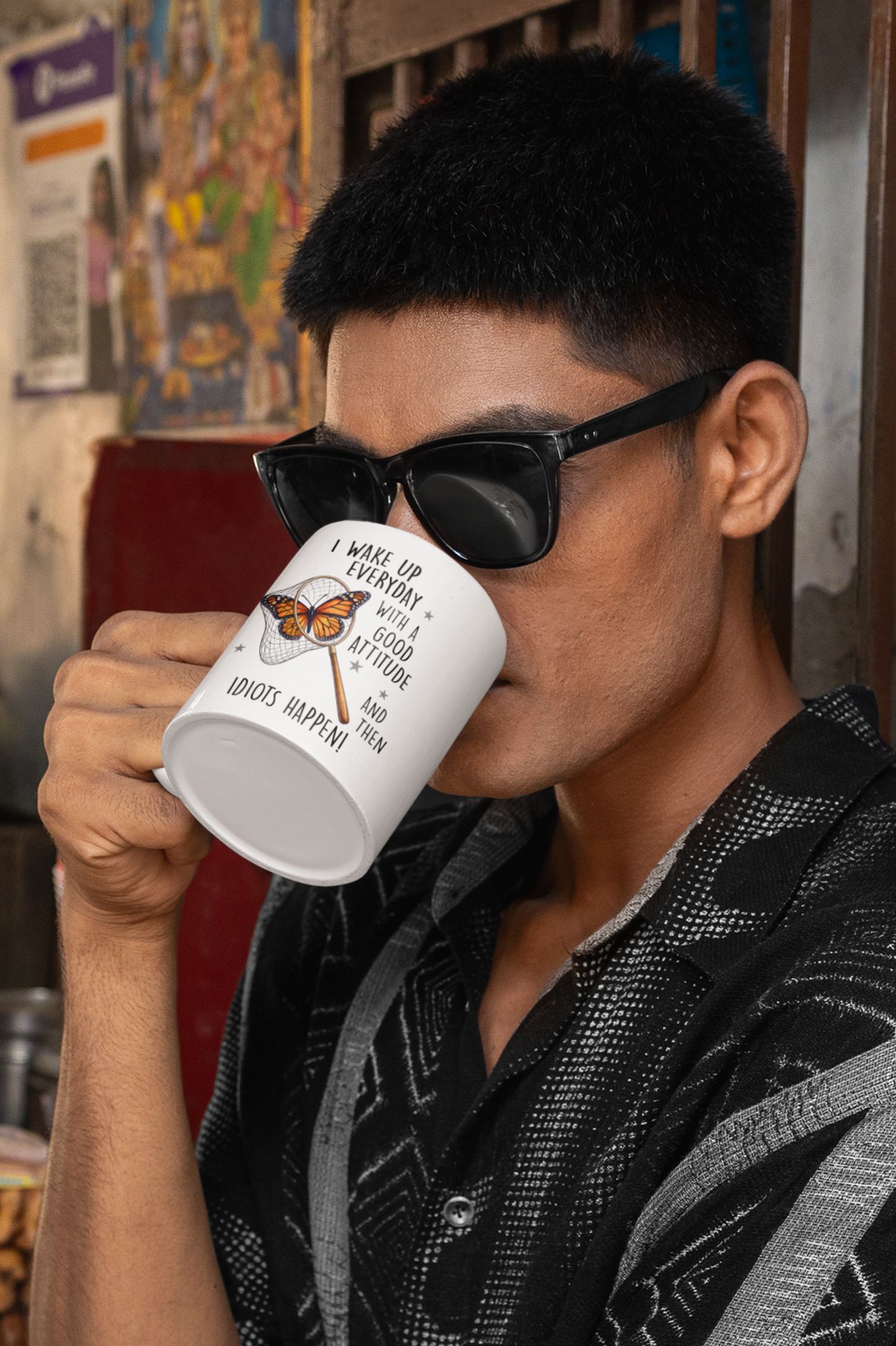 Man drinking from white butterfly humor mug with funny sarcastic quote