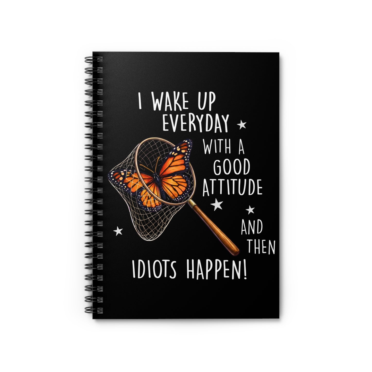 Black spiral notebook with funny butterfly design that says I Wake Up Everyday With a Good Attitude And Then Idiots Happen on a black background