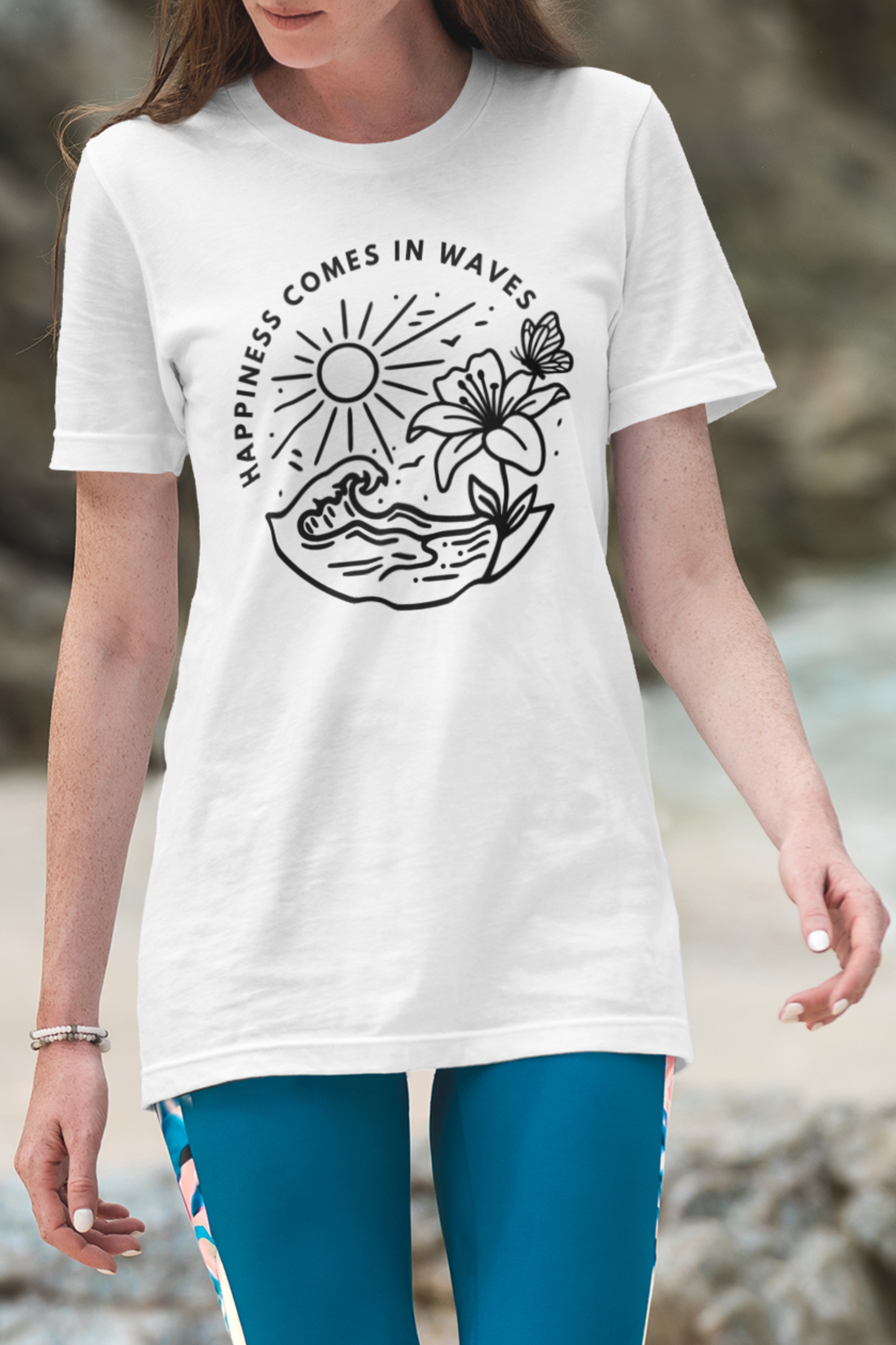 White Happiness Comes in Waves beach butterfly t-shirt shown on female model walking on the beach