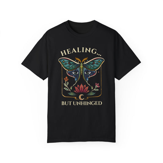 black shrit with an actias moth, floral design and emotional healing message