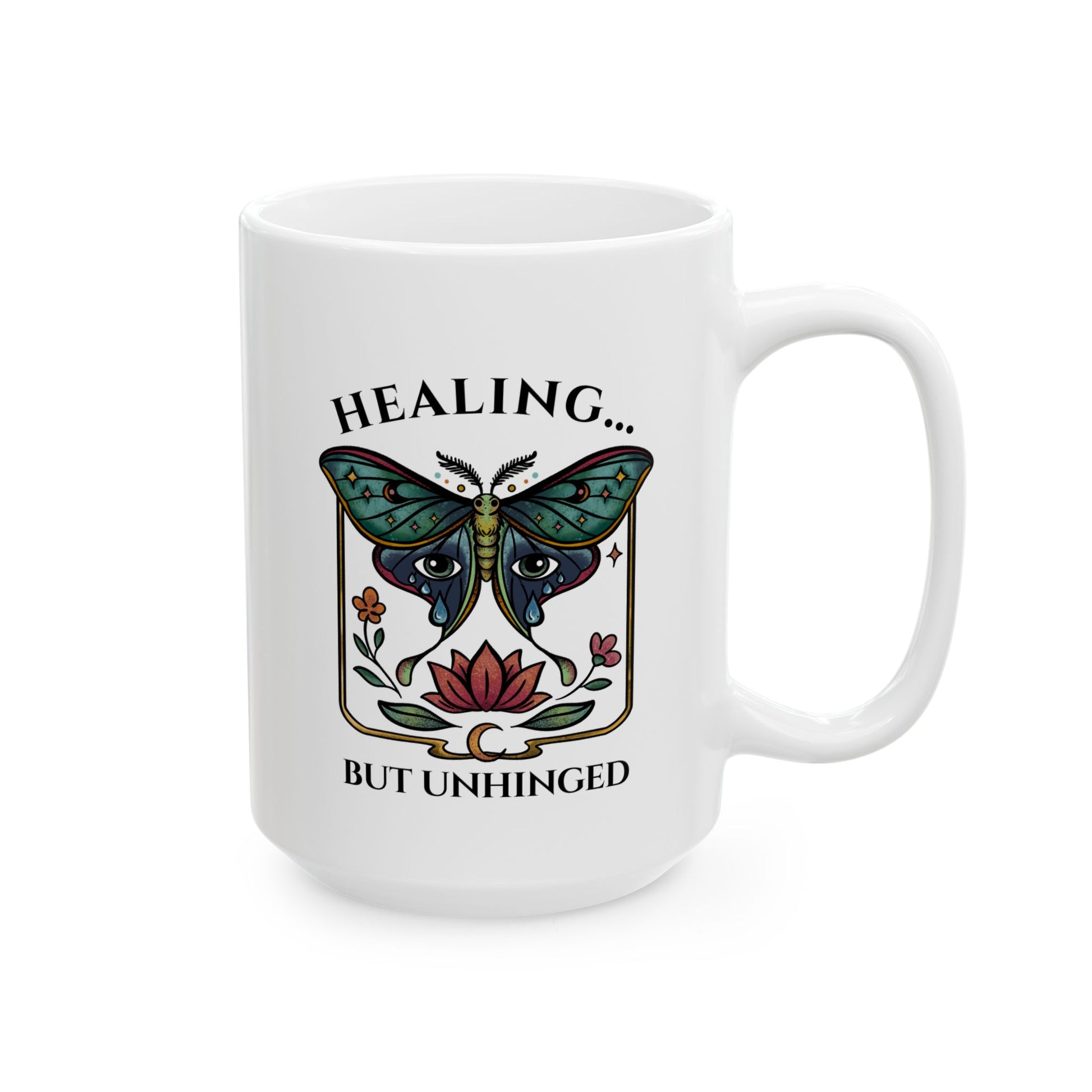 white ceramic 15oz cup with a luna moth, lotus flower, and crescent moon with a playful mental health message