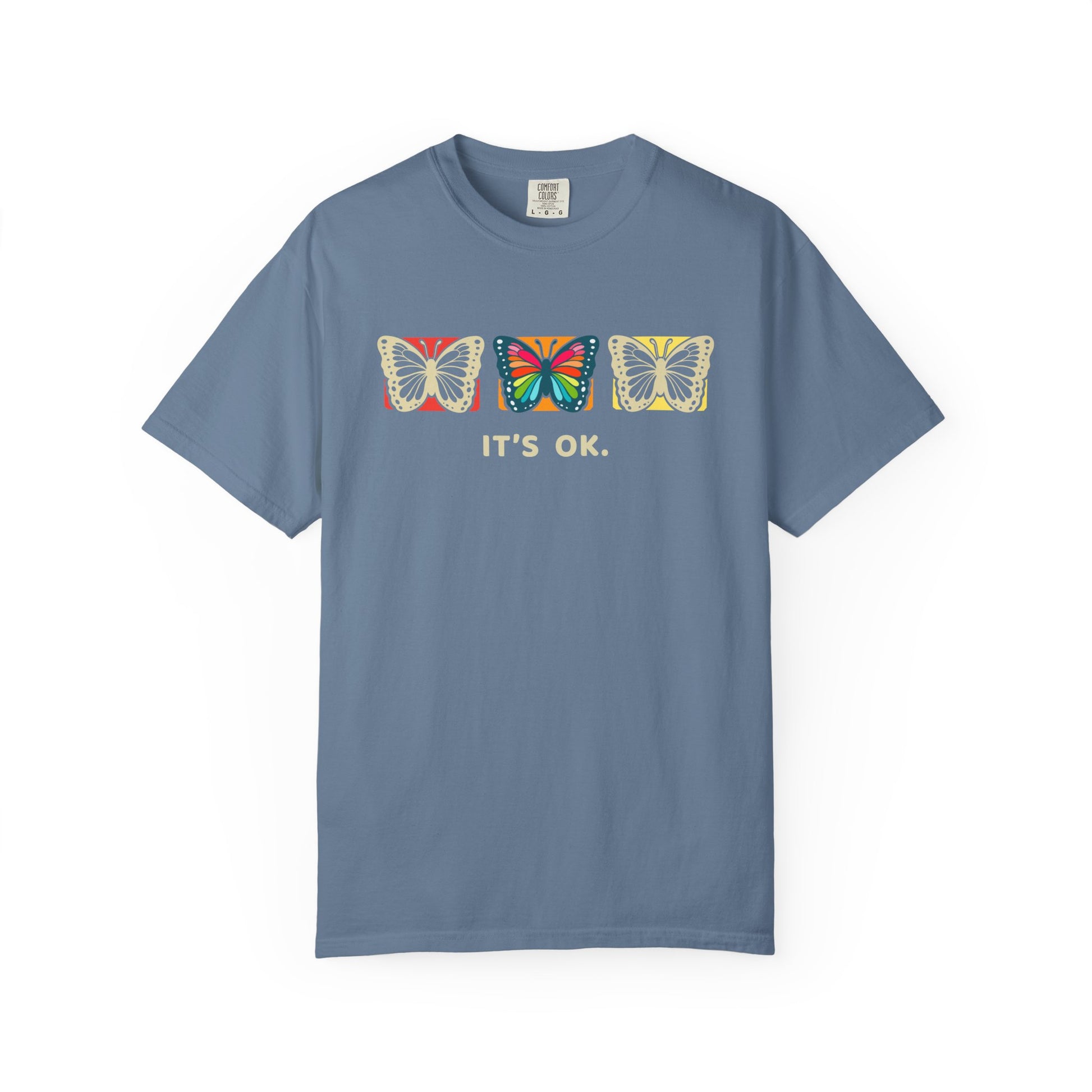 blue 'it’s ok' butterfly shirt featuring with three butterflies and simple positive affirmation in bold cream text