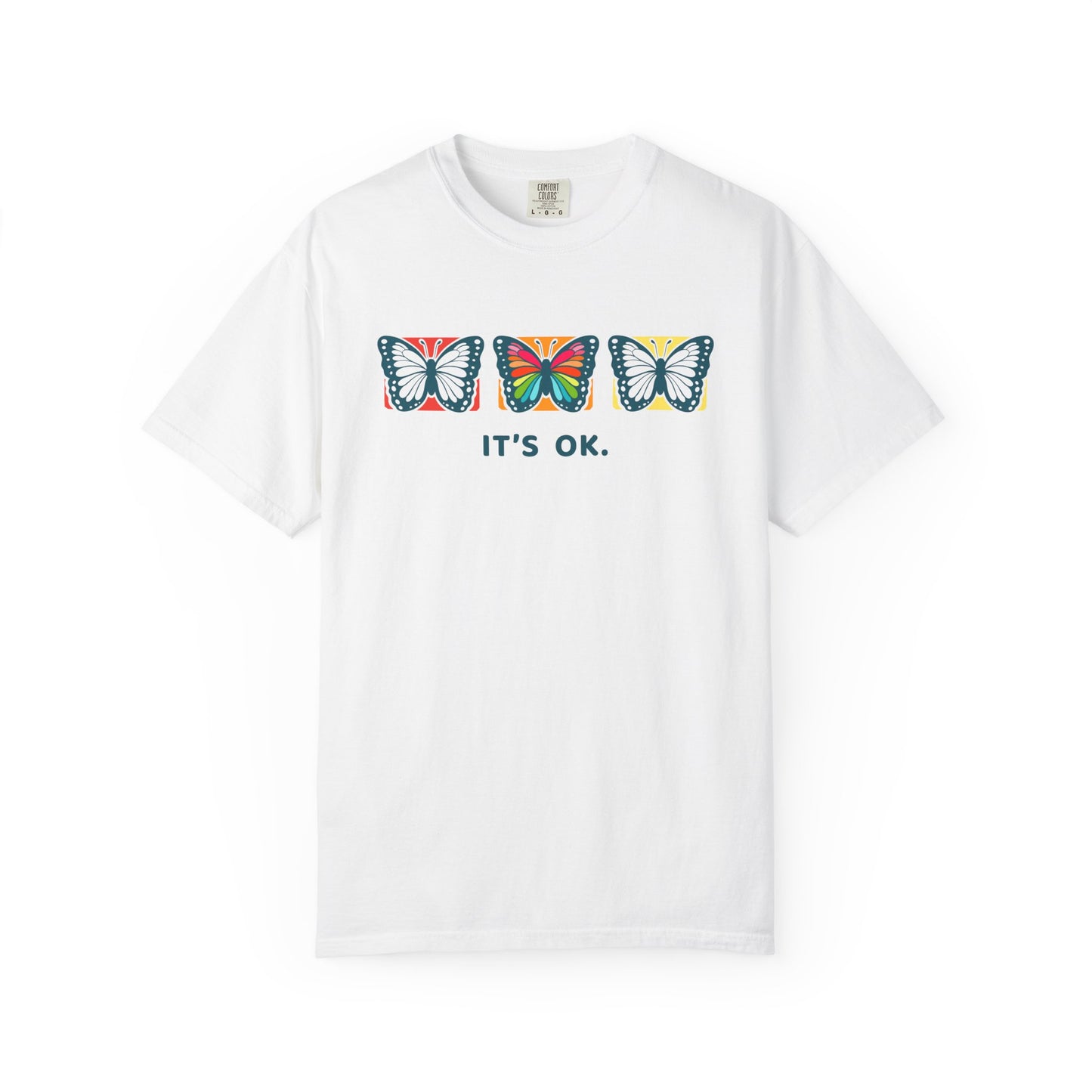 white 'it’s ok' butterfly shirt featuring with three butterflies and simple positive affirmation in bold blue text