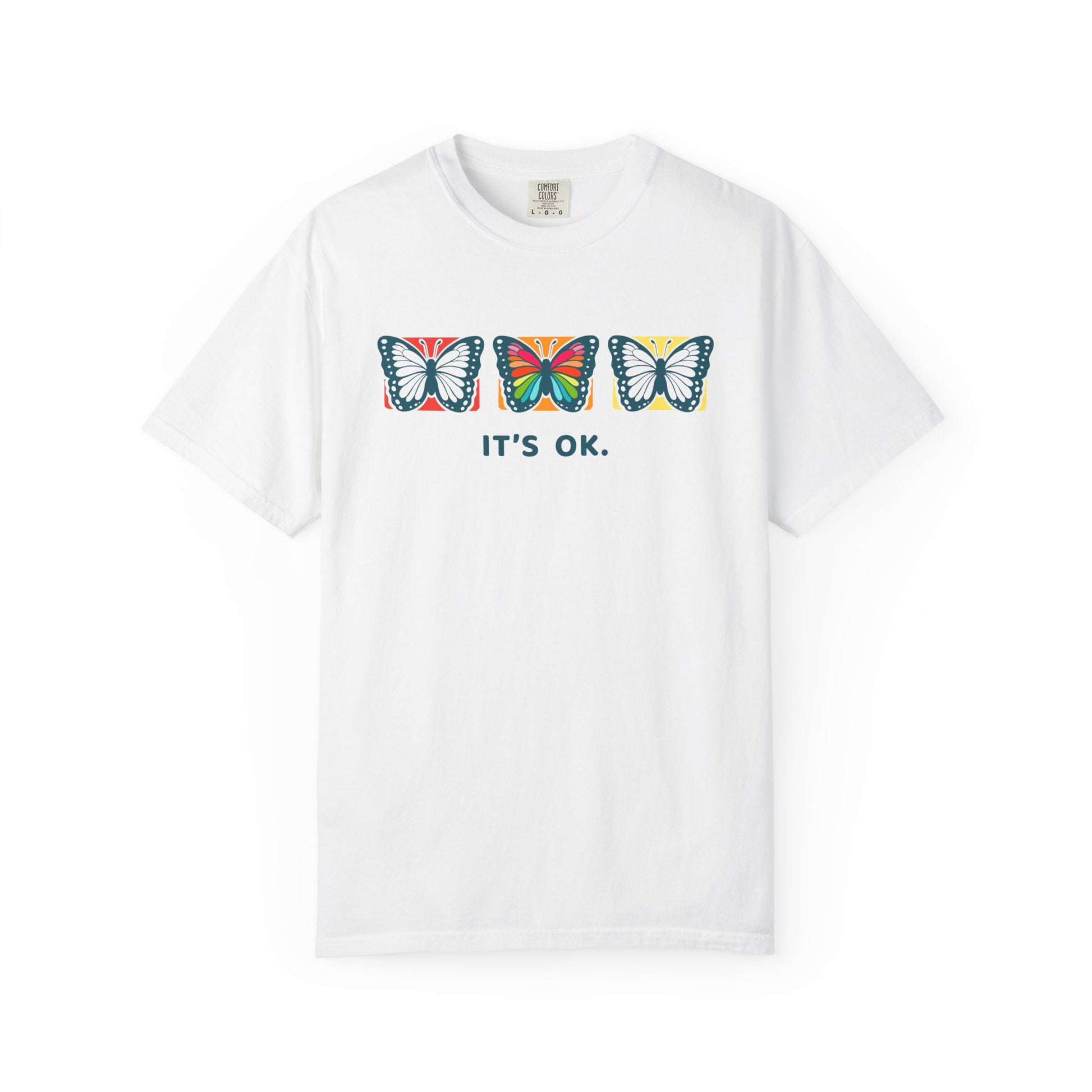 white 'it’s ok' butterfly shirt featuring with three butterflies and simple positive affirmation in bold blue text
