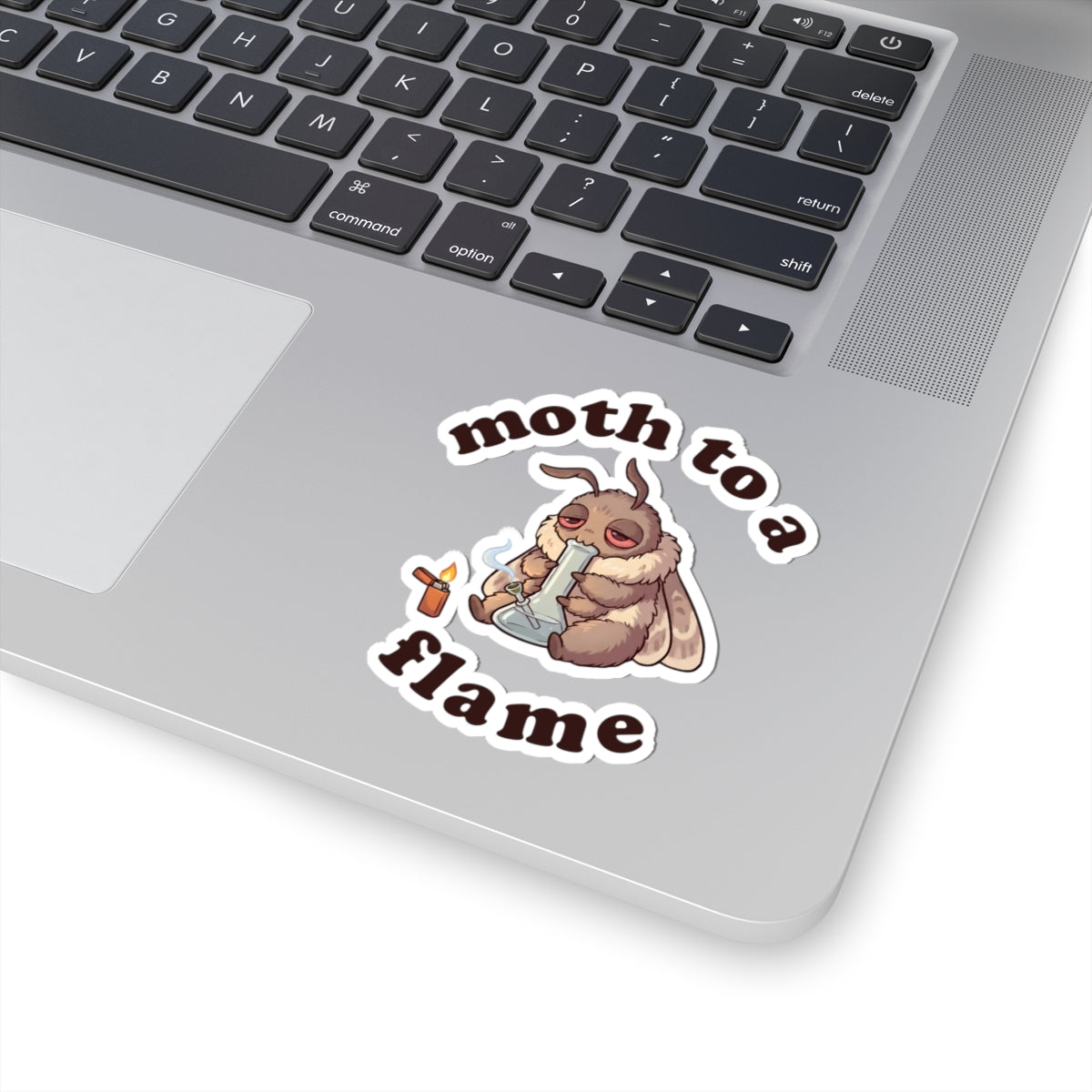 Funny Moth To a Flame weed sticker on a laptop, glossy vinyl cannabis decal with sleepy moth, bong, and lighter artwork.