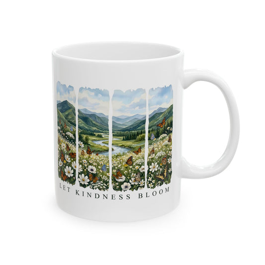 White ceramic 11oz mug featuring a floral mountain landscape with butterflies and the phrase Let Kindness Bloom