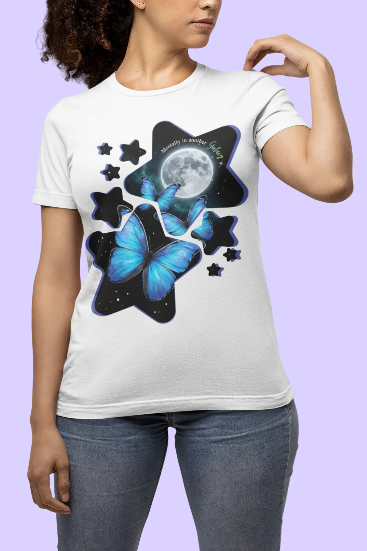 Model wearing blue morpho butterfly celestial moon galaxy t-shirt on a light gray background