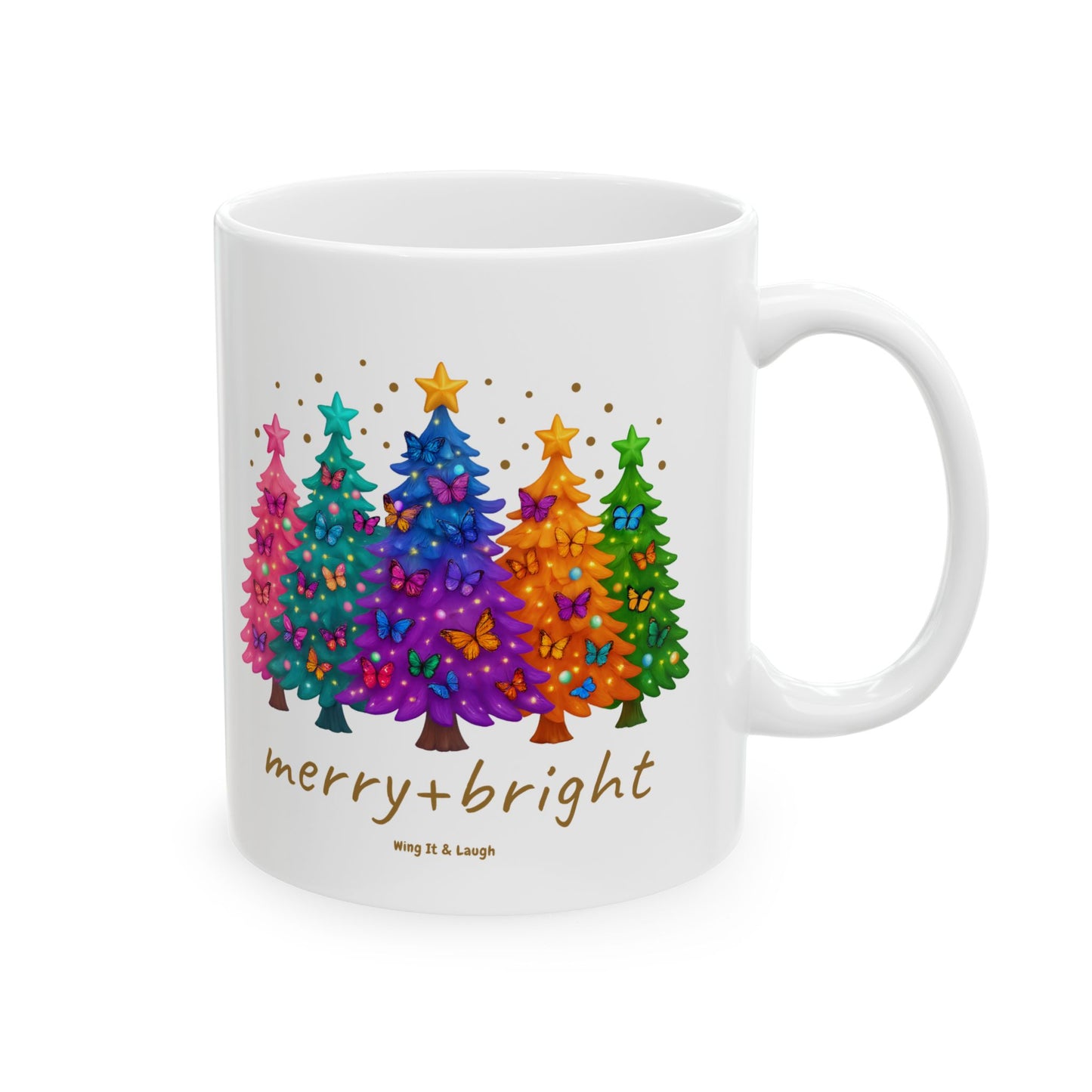 White mug with colorful Christmas trees and 'merry + bright' text on a white background.