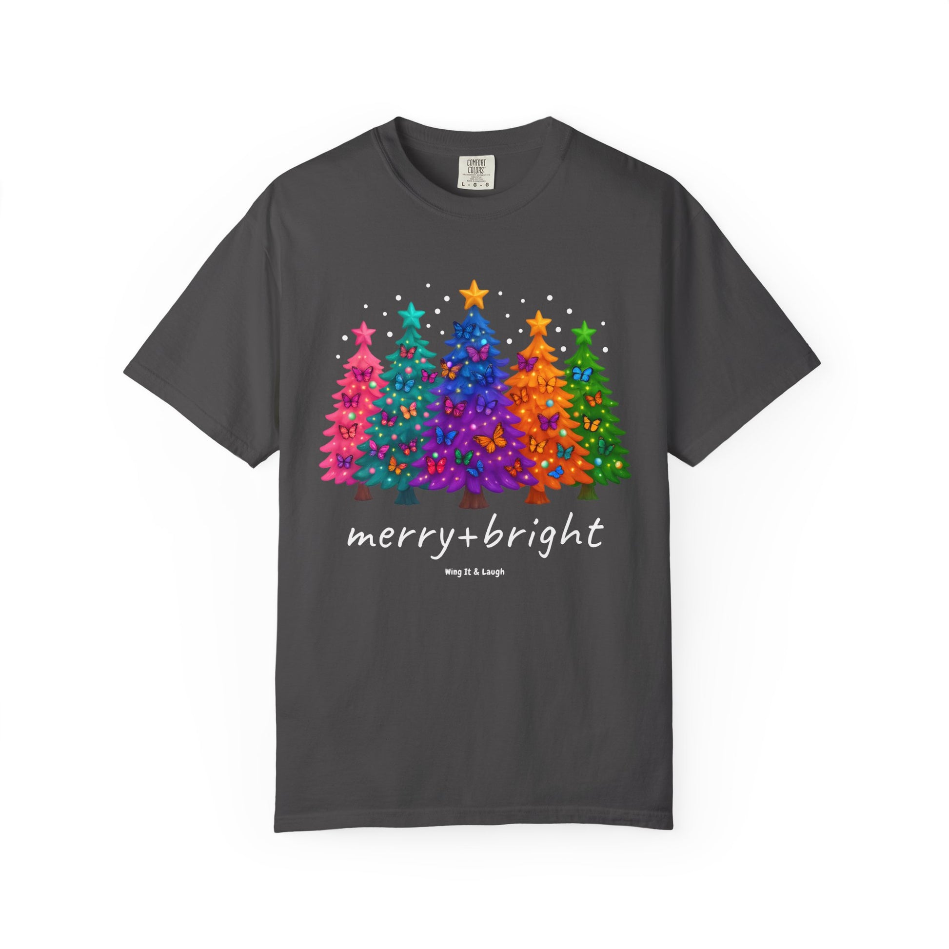 Gray t-shirt with colorful stars and christmas trees design and 'merry and bright' text on a white background.