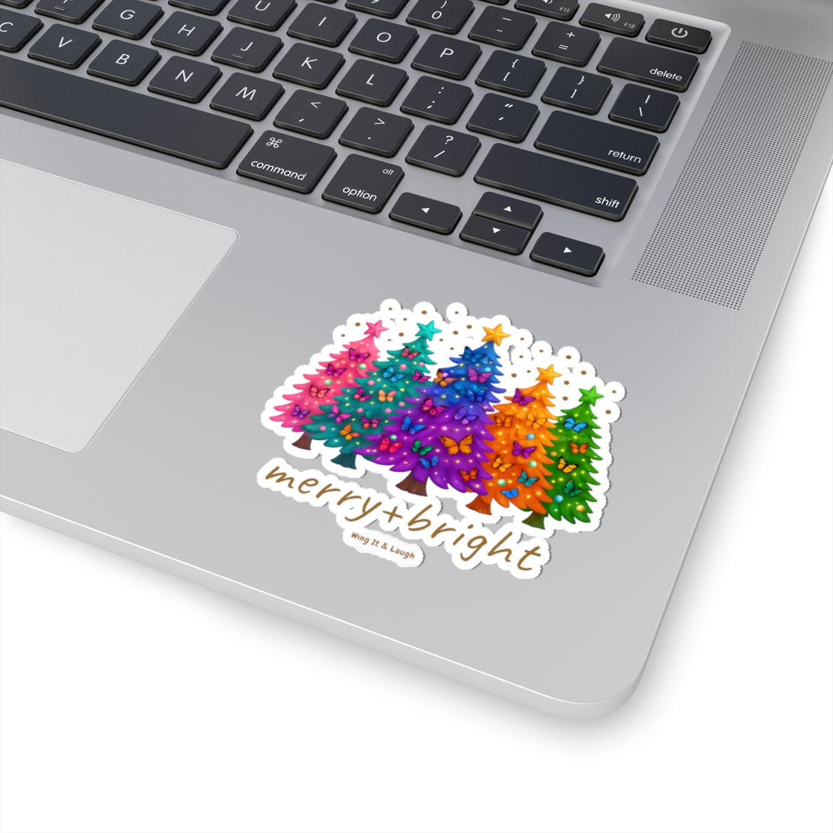 Merry and bright butterfly Christmas tree sticker on laptop