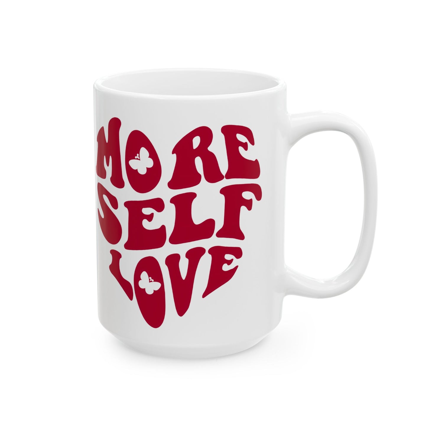 Angled view of 15 oz white More Self Love self care affirmation mug on a white background