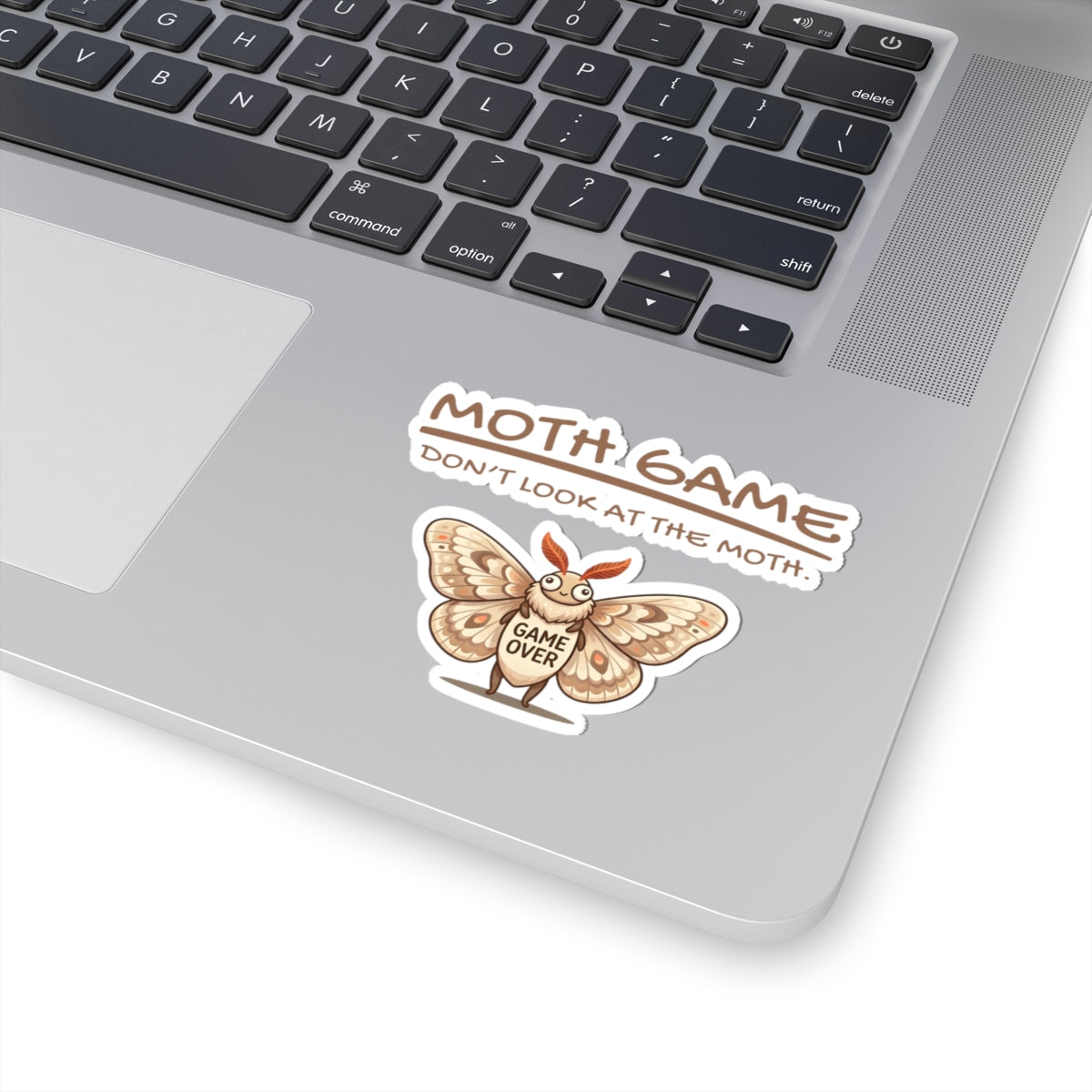Moth Game Don’t Look At The Moth sticker on a laptop with funny moth meme and gaming humor design on the palm rest area