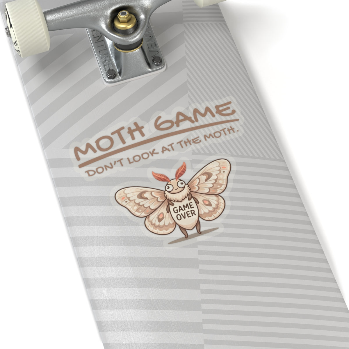 Moth Game funny moth sticker applied to a skateboard, showing the novelty meme-style moth design on a white background