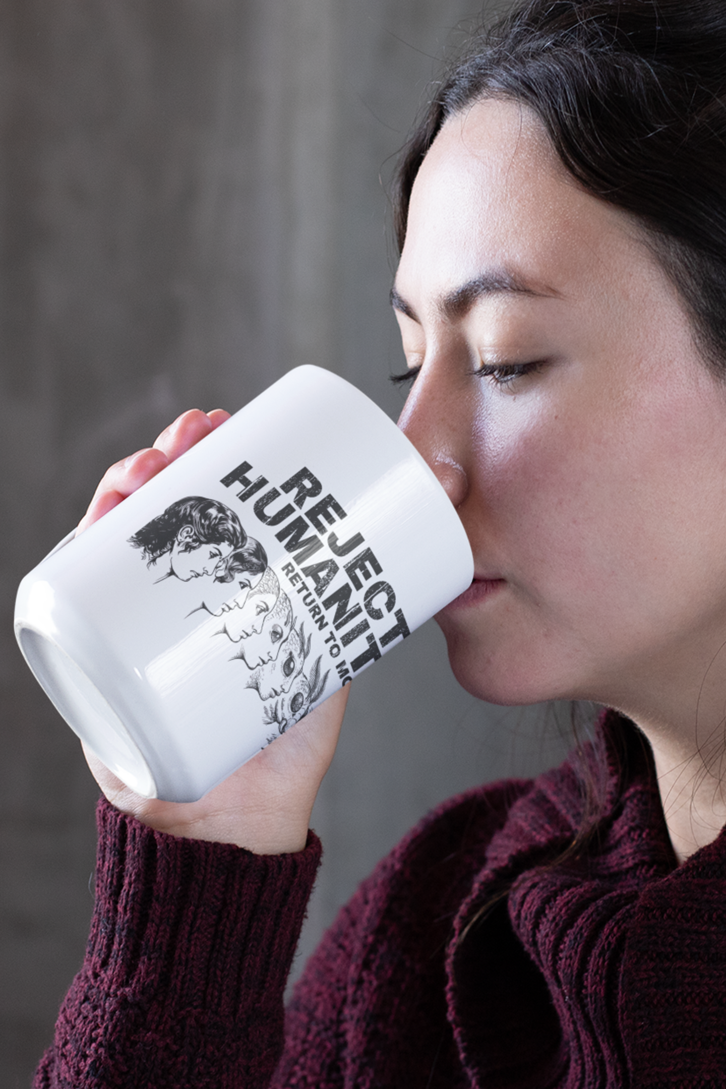 Woman drinking from funny moth coffee mug featuring moth evolution meme design in a casual setting.