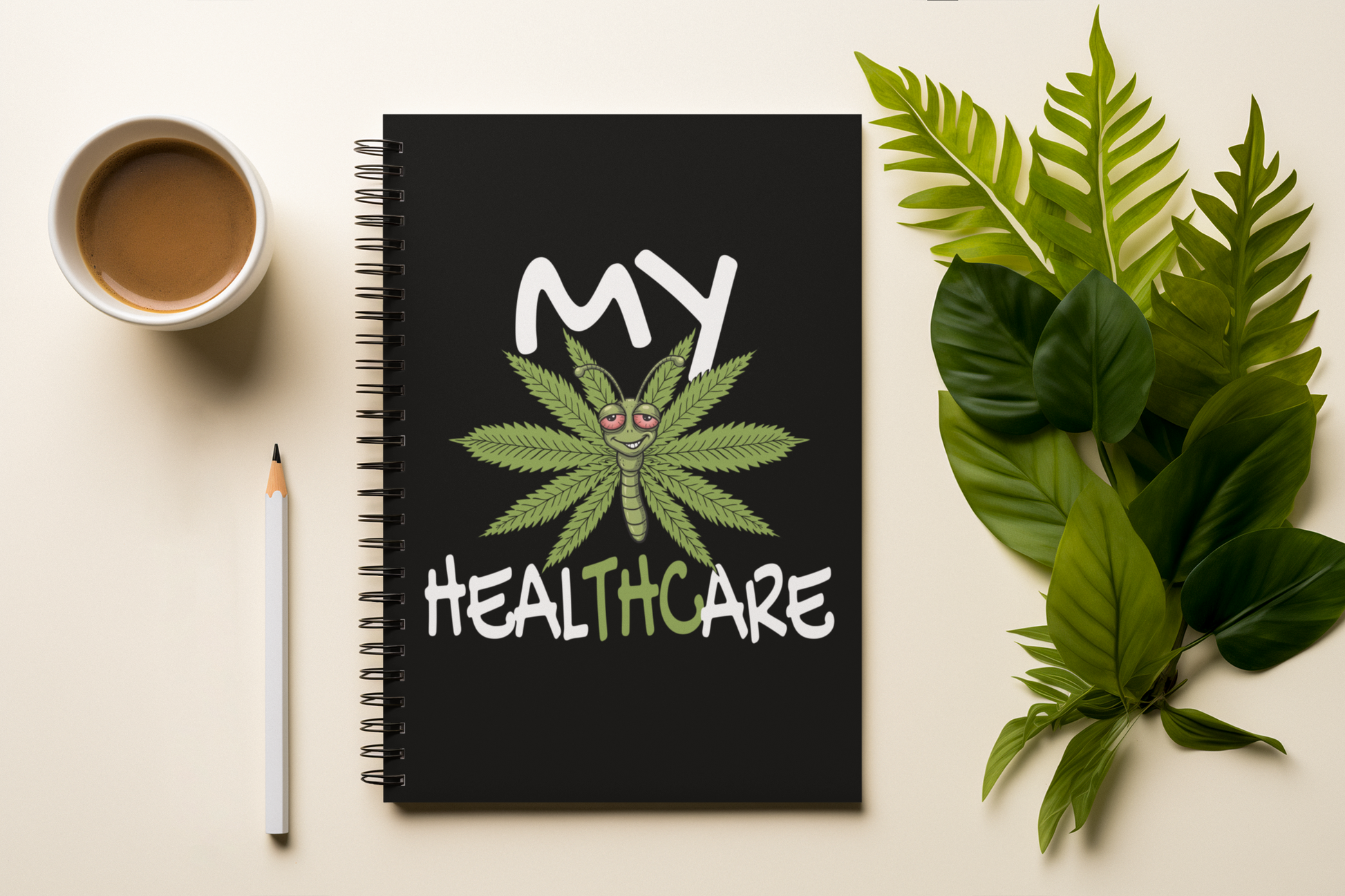 My Healthcare cannabis butterfly spiral notebook on a desk with coffee, pencil, and green leaves, styled as a funny 420 journal gift.