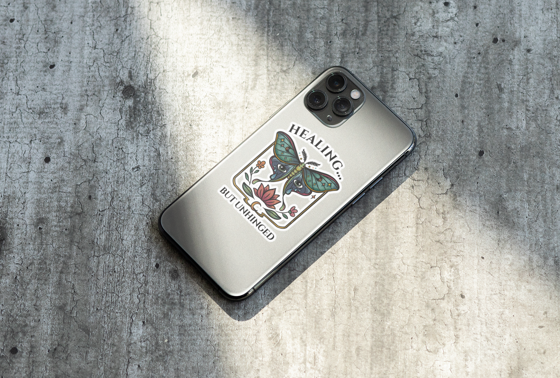 phone case with butterfly design and text on a textured surface
