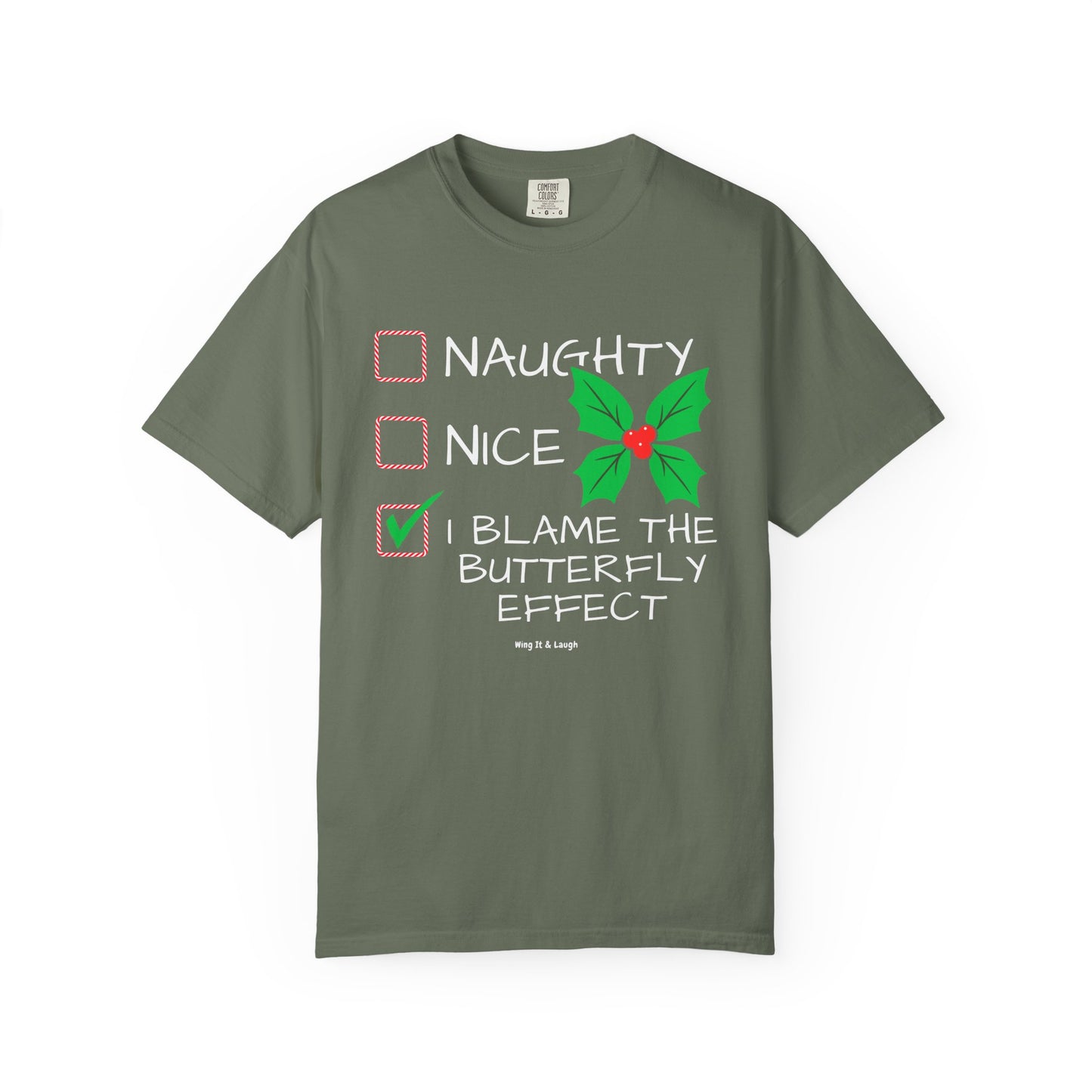 Green unisex “Naughty Nice I Blame the Butterfly Effect” Christmas checklist t-shirt on white background.