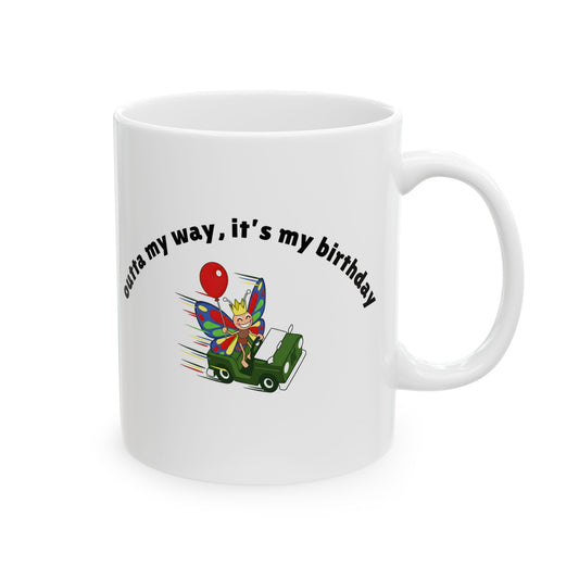 White ceramic birthday mug featuring a colorful butterfly riding a vehicle with the phrase "Outta My Way, It's My Birthday" printed on the front.