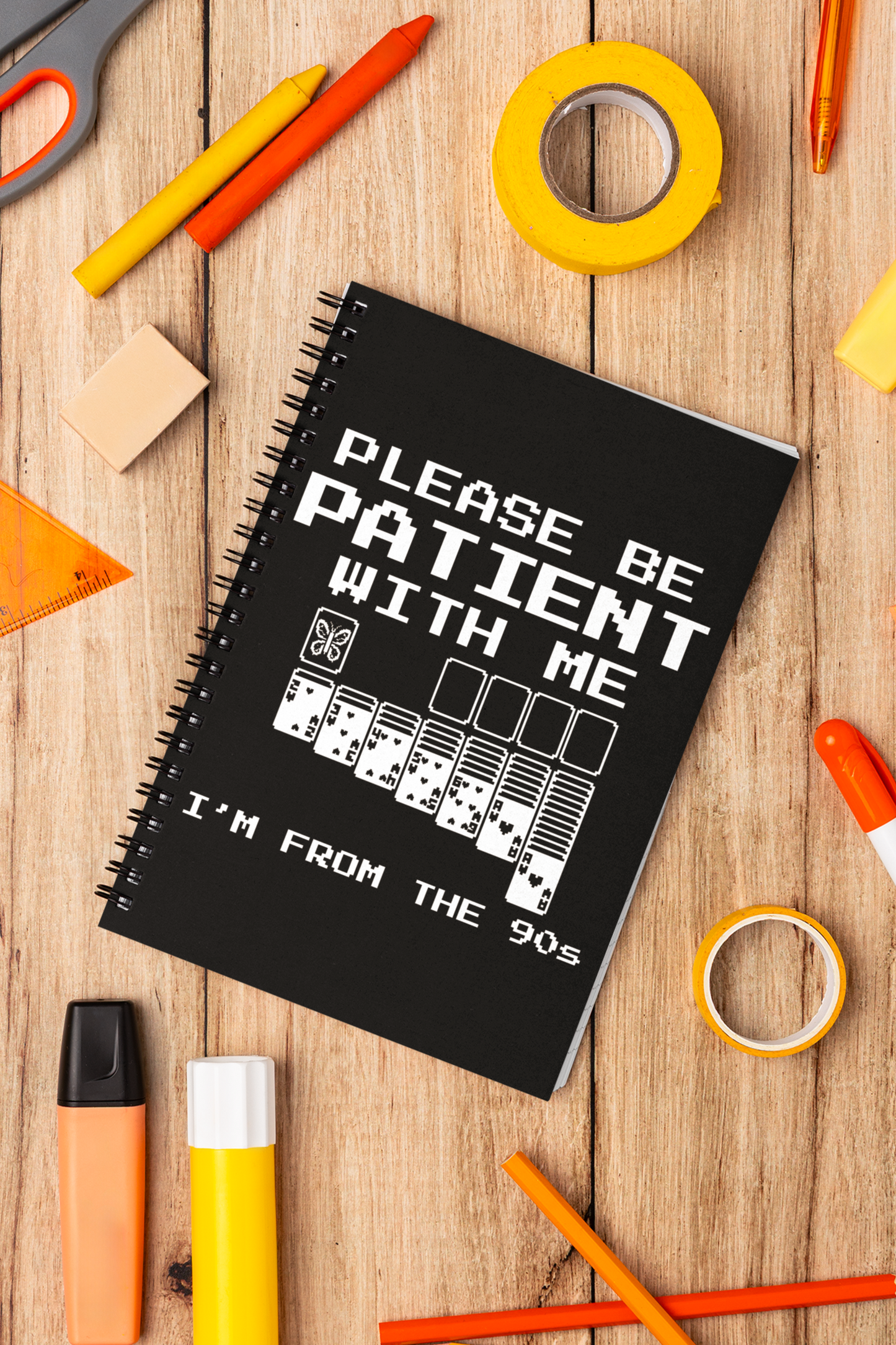 Funny 90s nostalgia butterfly notebook with stationery on a wooden surface with stationery items