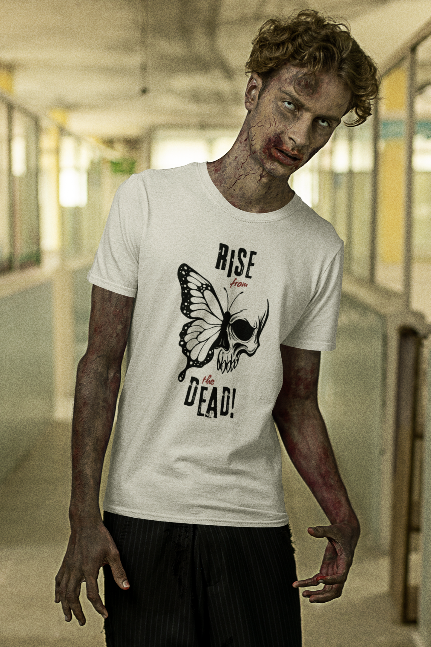 Living dead man wearing a white t-skull-butterfly tee in an indoor setting
