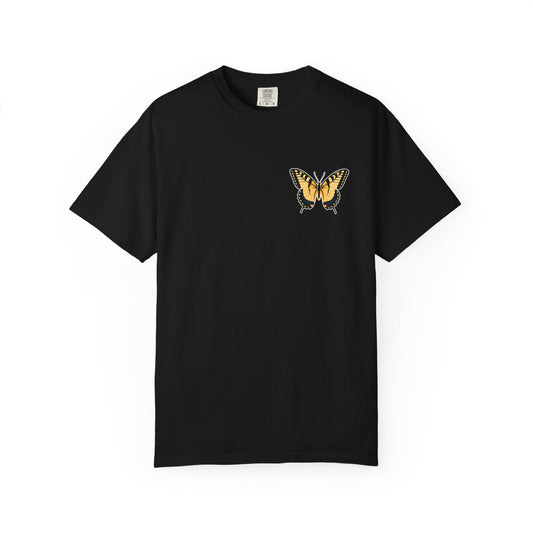 Black garment-dyed butterfly t-shirt featuring a yellow and orange butterfly chest graphic for nature lovers and summer fashion.